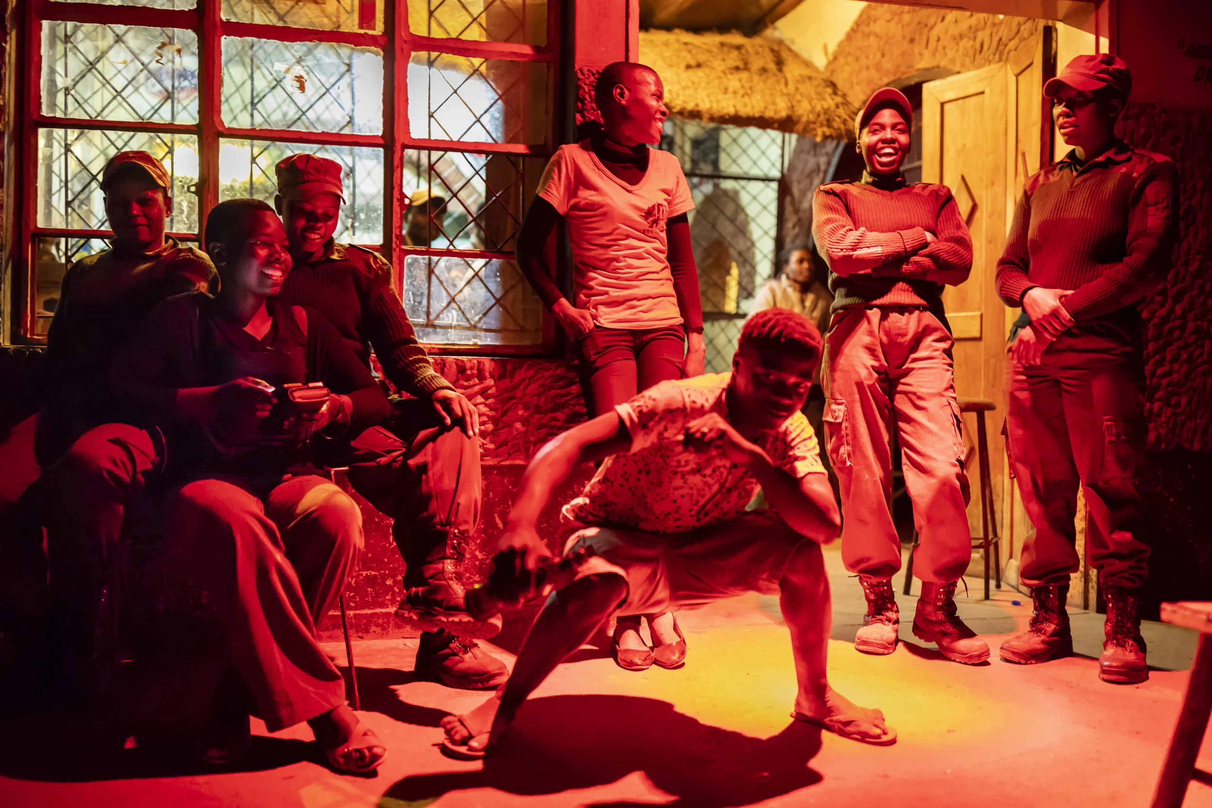 PHUNDUNDU WILDLIFE AREA, ZIMBABWE, JUNE 2018: Femal Rangers visit a local truck stop. Before their new roles as conservation rangers, a number of these rangers may have seen such truck stops as their only means of making money through prostitution.