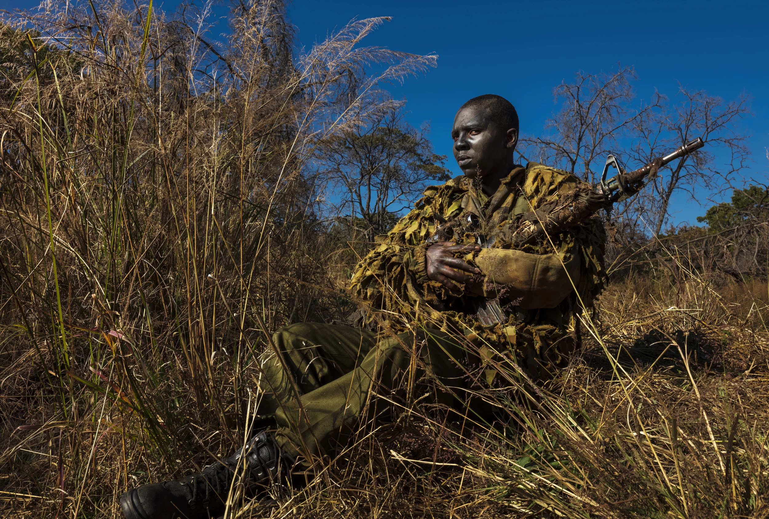 PHUNDUNDU WILDLIFE AREA, ZIMBABWE, JUNE 2018: Specially selected women from an all female. conservation ranger force undergo sniper training in the bush to curb poaching. Akashinga (meaning the ‘Brave Ones’ in local dialect) is a community-driven co