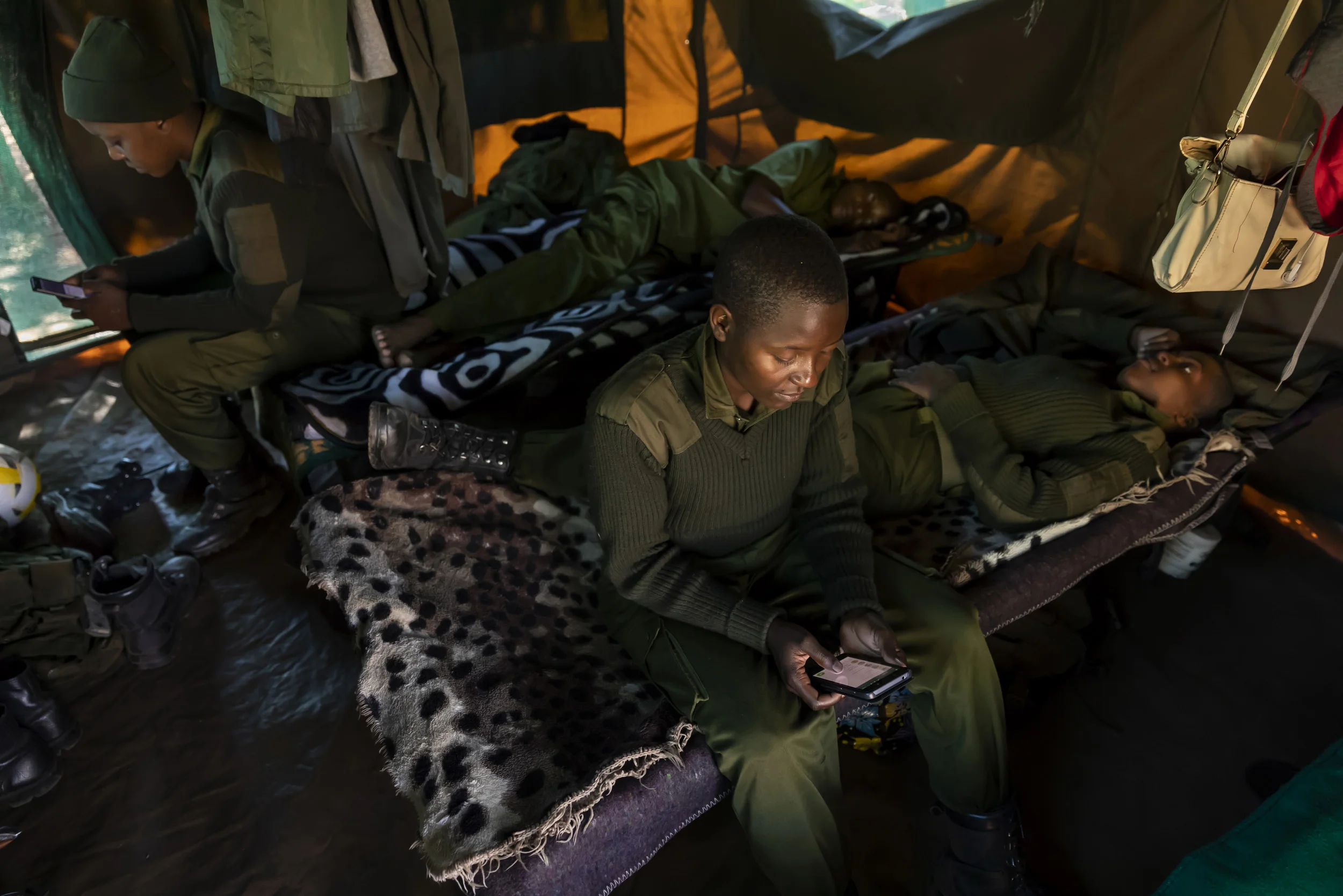 PHUNDUNDU WILDLIFE AREA, ZIMBABWE, JUNE 2018: Members of the all female conservation ranger force Akashinga seen in their spartan tent accommodation in their camp. Akashinga (meaning the ‘Brave Ones’ in local dialect) is a community-driven conservat