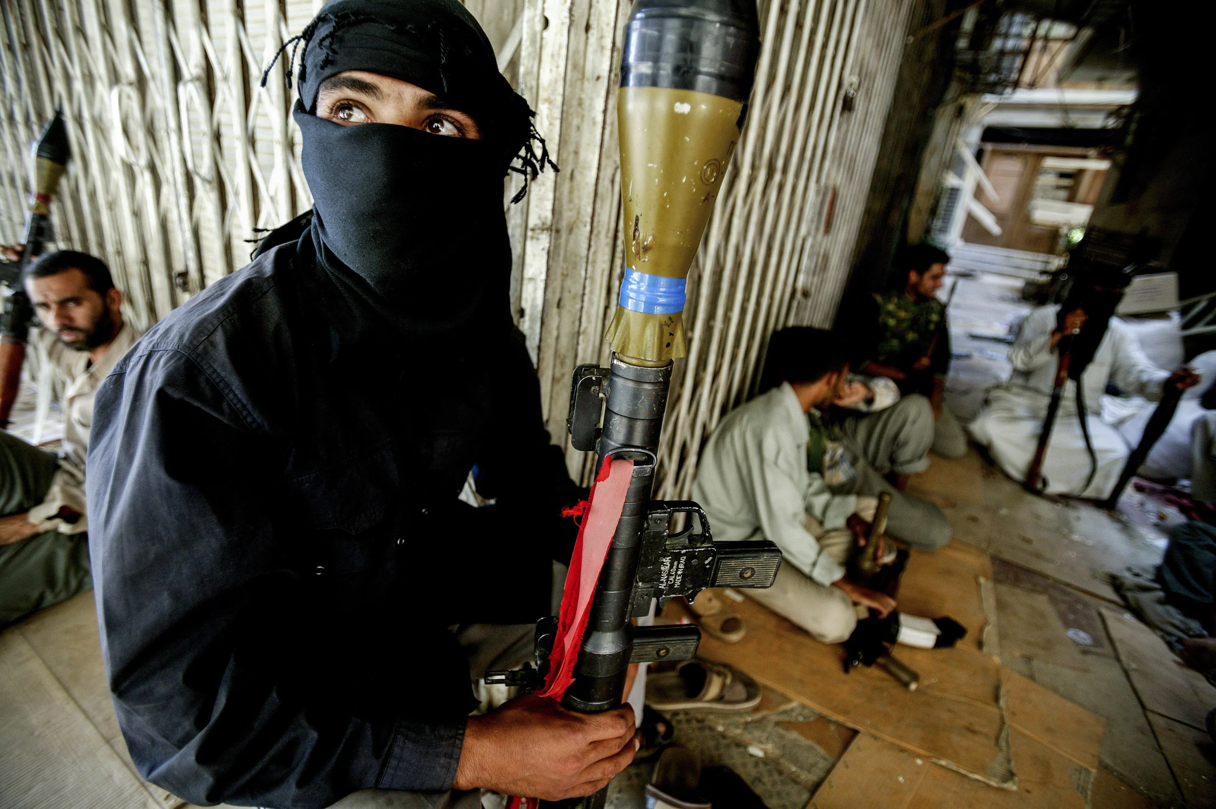 KARBALA, IRAQ - MAY 17: Al-Mehdi Army supporters of radical cleric Mugtada Al-Sadder fight in the streets of Karbala. This group clashes on a daily basis with the coalition forces and tensions are high in the area. The fighting is taking place next