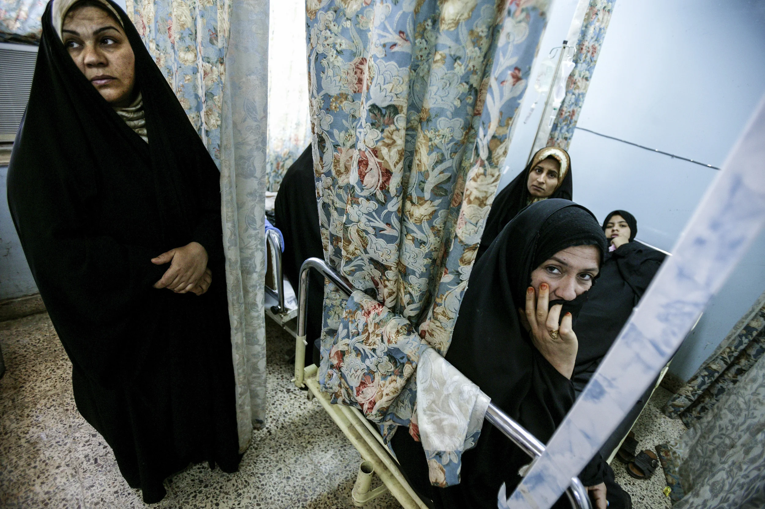 NAJAF, IRAQ - MAY 7: Relatives of the wounded wait in a local hospital in Najaf. 8 civilians were killed and 16 wounded as the coalition forces retaliated against militia attacks in the area. *** Local Caption *** Assignment Iraq