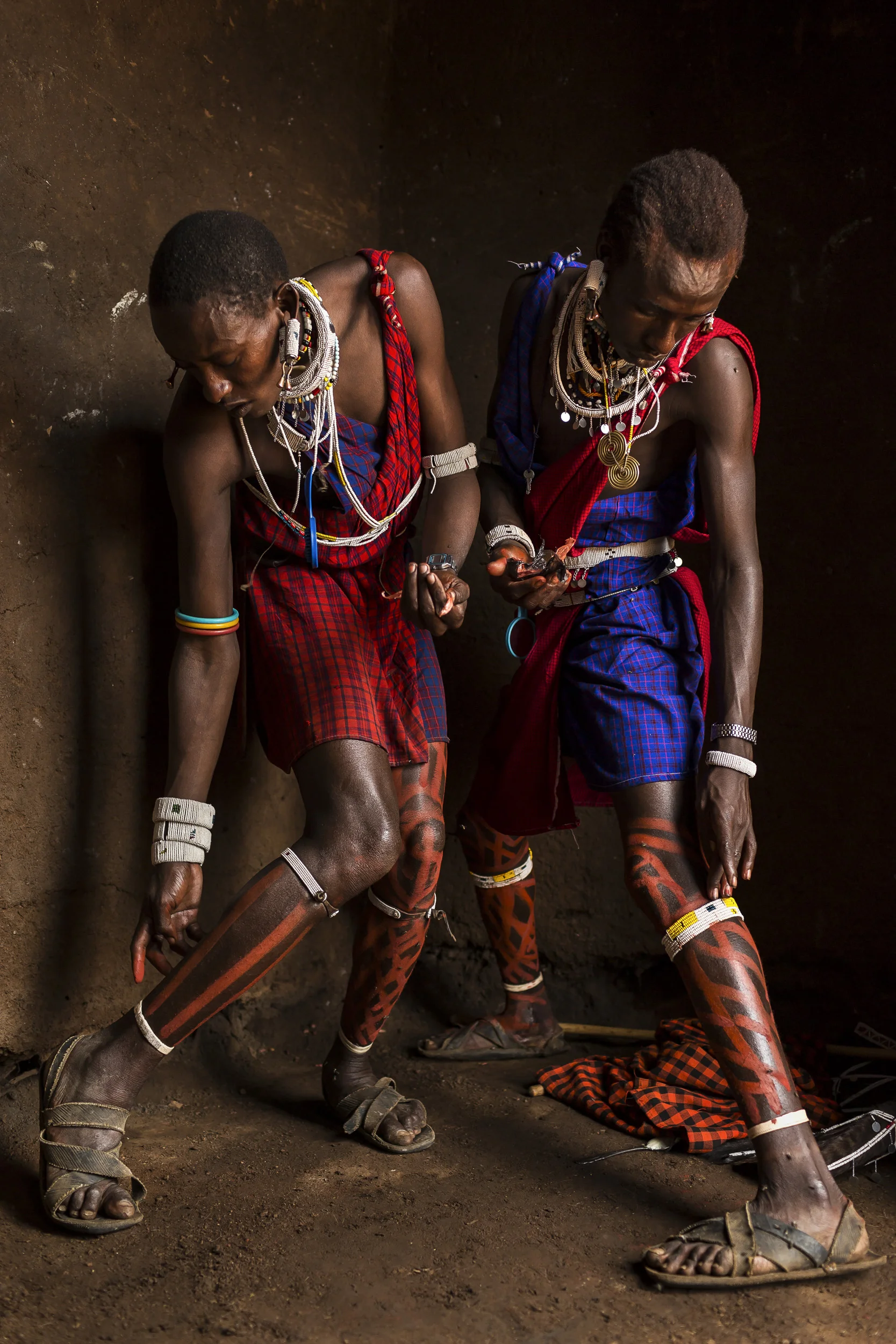 LOLIONDO, NORTHERN TANZANIA, NOVEMBER 2012: Images from a Masai coming –of-age ceremony in a remote Masai village in Loliondo, Northern Tanzania, 2 November 2012. Two of the young warriors in this ceremony are wearing a Lion Mane head-dress from a l