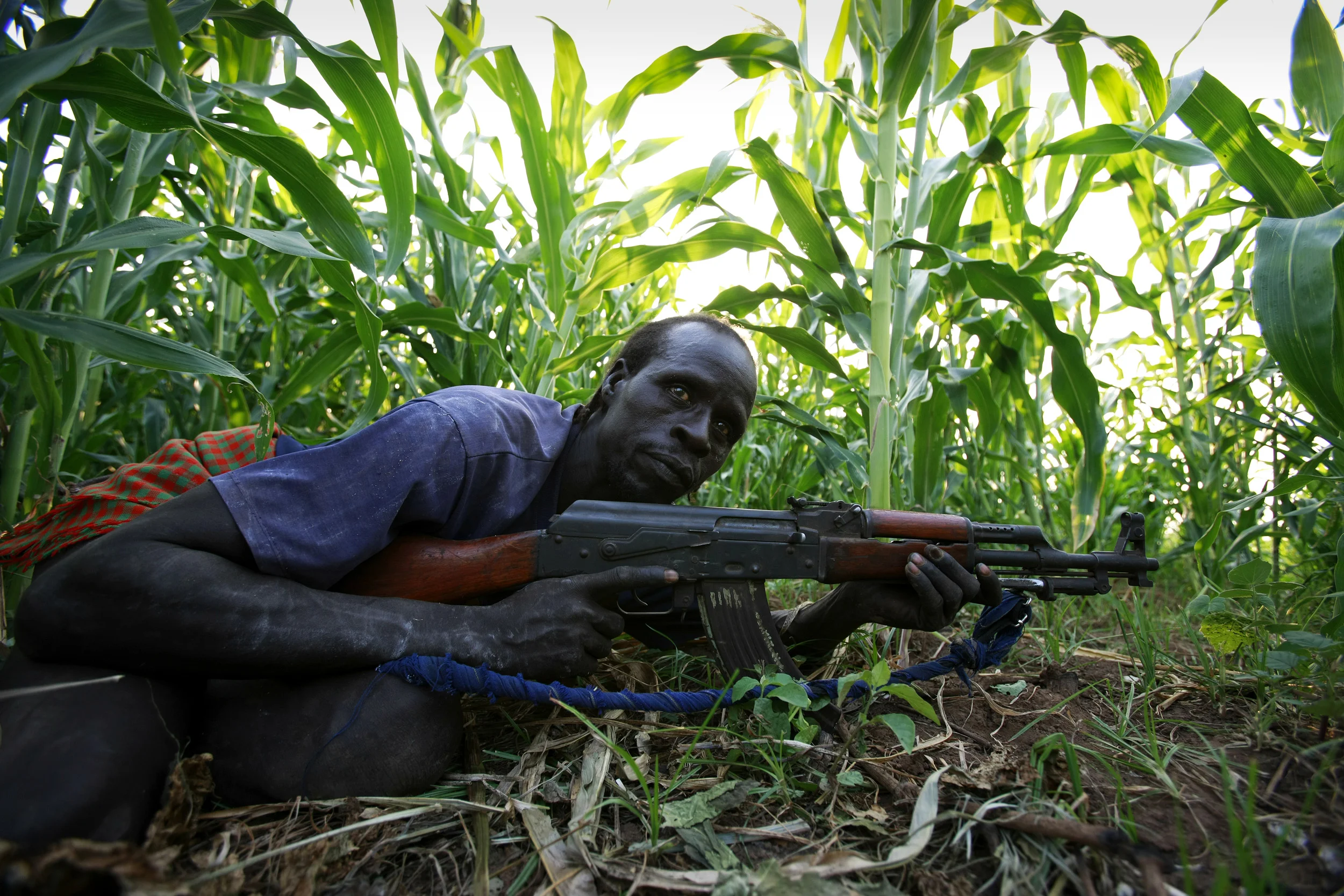 DUS, OMO VALLEY, ETHIOPIA, DECEMBER 2007: Images of a Karo tribesman clashing with Bume people who have fired on them over a water rights dispute in the Omo Valley, South West Ethiopia, 14 December 2007. The Karo, with a population of about 1000,are