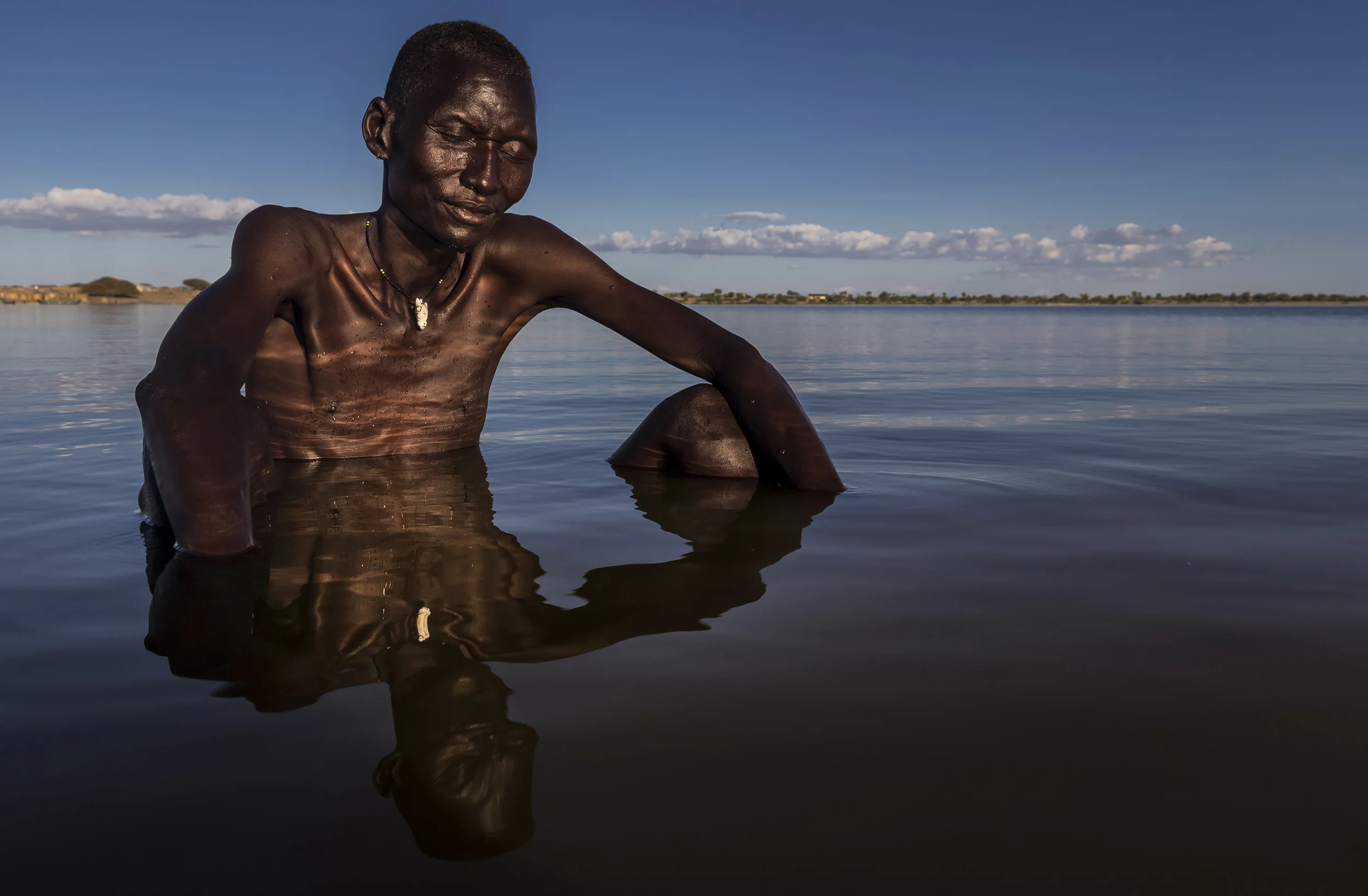 TURKANA, KENYA, 8 OCTOBER 2014: Scenes from Longetch fishing village on the shores of Lake Turkana, Kenya, the world's largest inland desert lake. This region of the lake is a well know spawning ground and at the heart of fishing commerce for the Tu