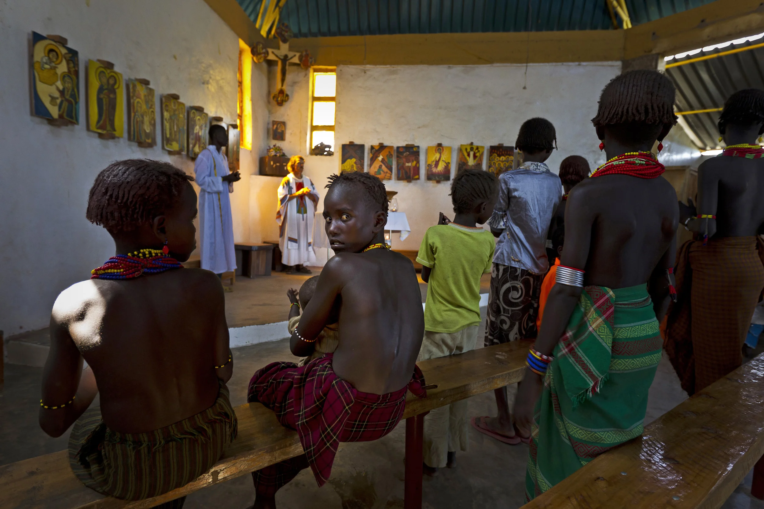 LAKE TURKANA, NORTHERN KENYA, MAY 2010: Dasenetch pastoralists attend a church service at the local Catholic mission church in Ileret, North East Lake Turkana in North Kenya, 20 May 2010. The Dasenetch are moving slowly into a more modern way of thi