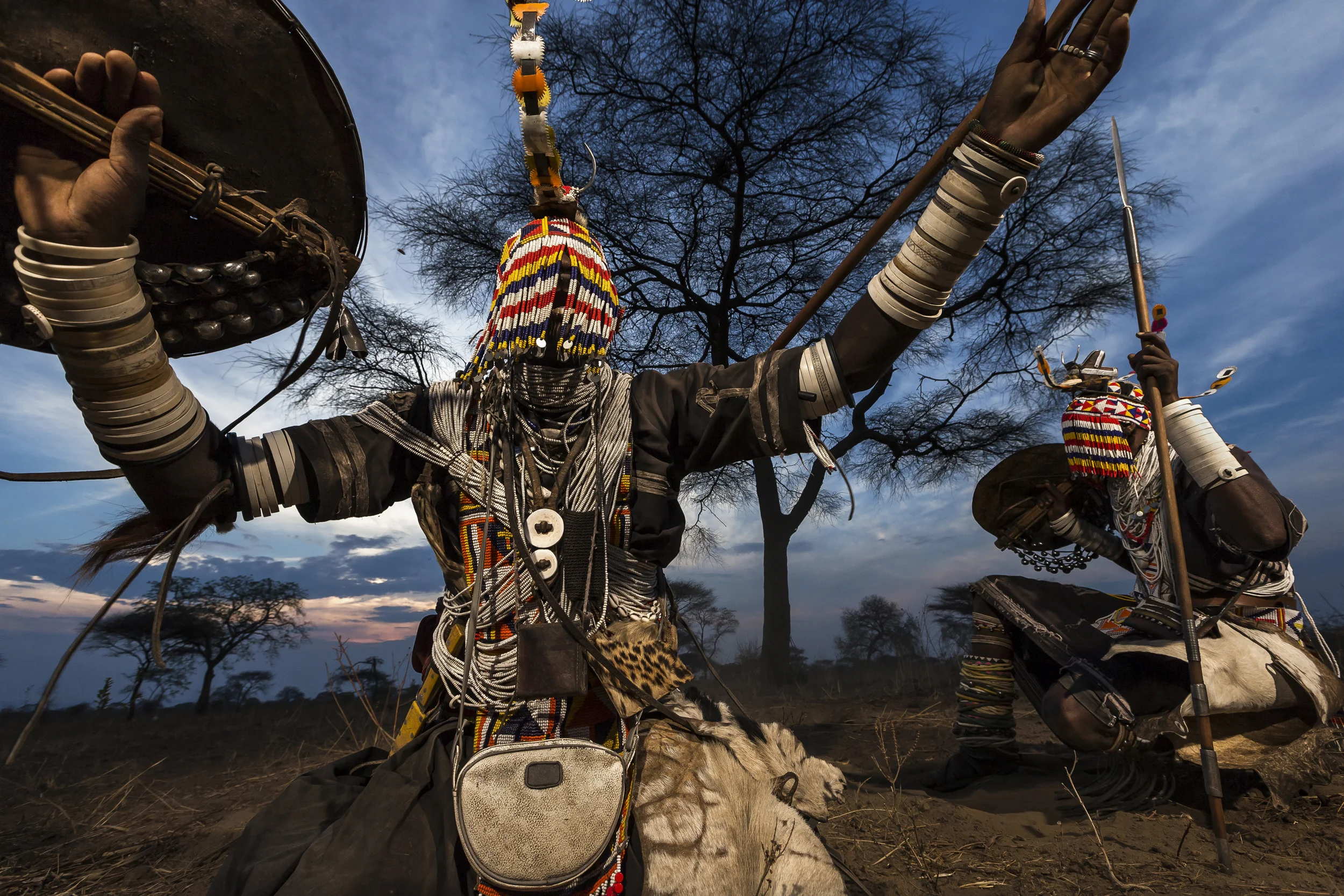 MPIMBWE, WESTERN TANZANIA, OCTOBER 2012: Lion Dancers from the Sakuma tribe perform the story of their lion killing outside a village in rural Mpimbwe, Western Tanzania, October 27, 2012. Lion dancers are men who have killed a lion in defense of the