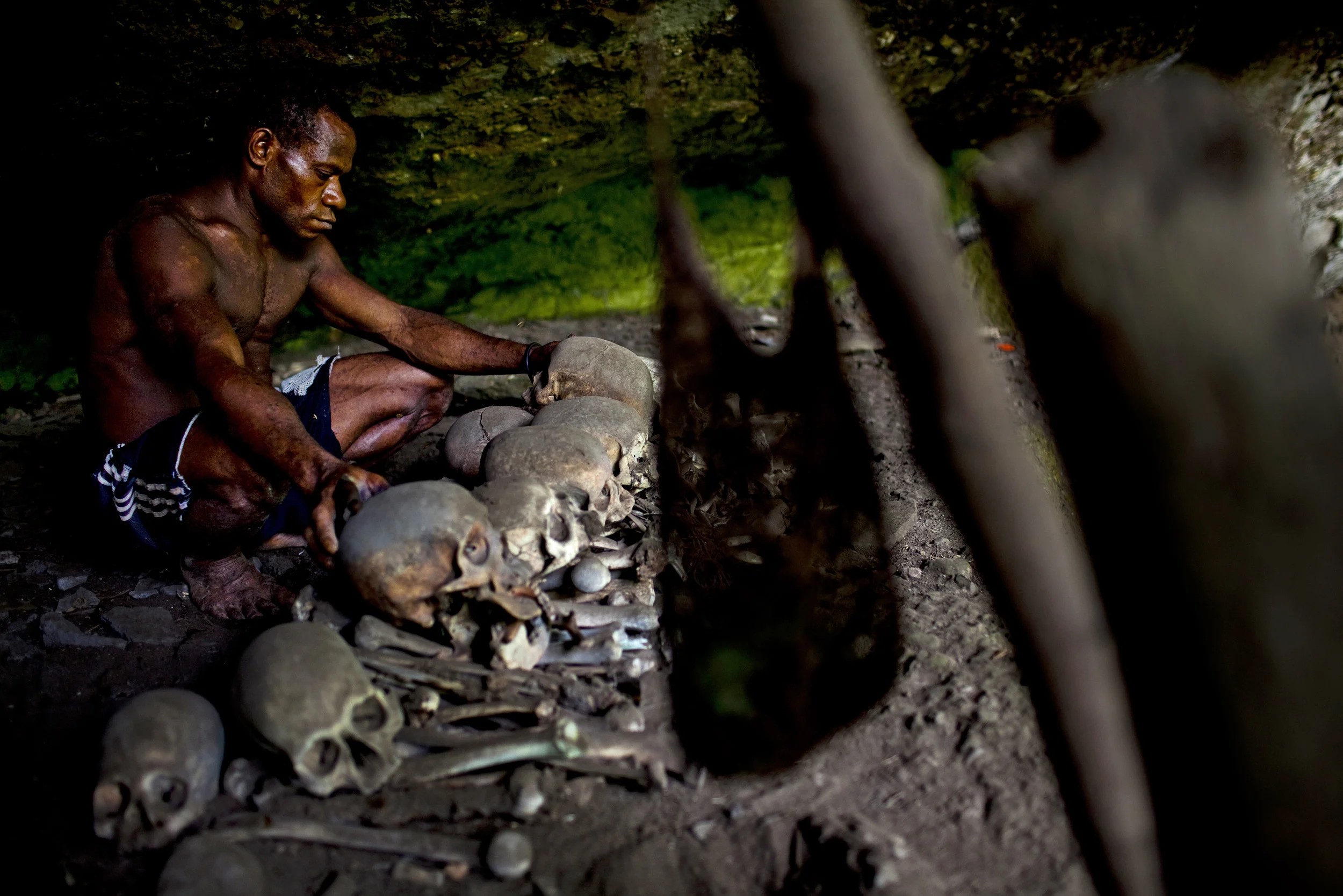 MIDDLE SEPIK, PAPUA NEW GUINEA-DECEMBER 2008: A man prays christiian prayers after a pilgrimage to the forest cave home of his ancestors, the Karawari people of the middle Sepik river, 15 December 2008. The Karawari are the most remote of the flood