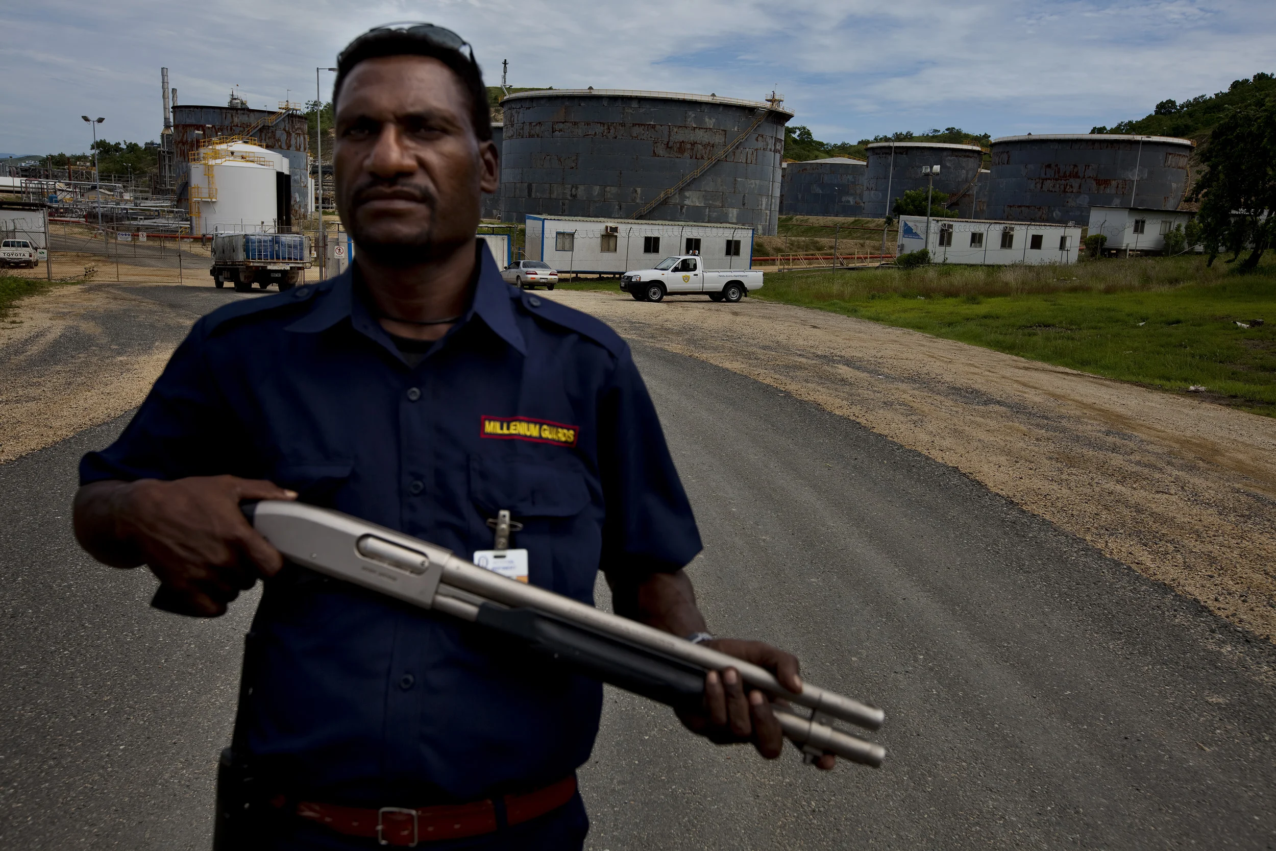 PORT MORSEBY, PAPUA NEW GUINEA-DECEMBER 2008: A security guard stands watch over a new refinery which has been built to handle oil and natural gas from the Highlands region of Tari which will be piped down to Port Morseby, the capital city of Papua