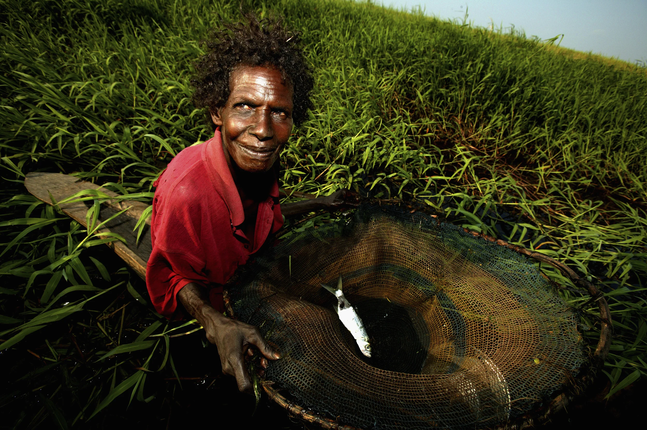 FLY RIVER REGION, PAPUA NEW GUINEA, AUGUST 2006: An old woman fishes along the Fly River, a remote region of Papua New Guinea where life-style is still derived almost entirely from man's relationship to the natural world, 27 August 2006. (Photo by B