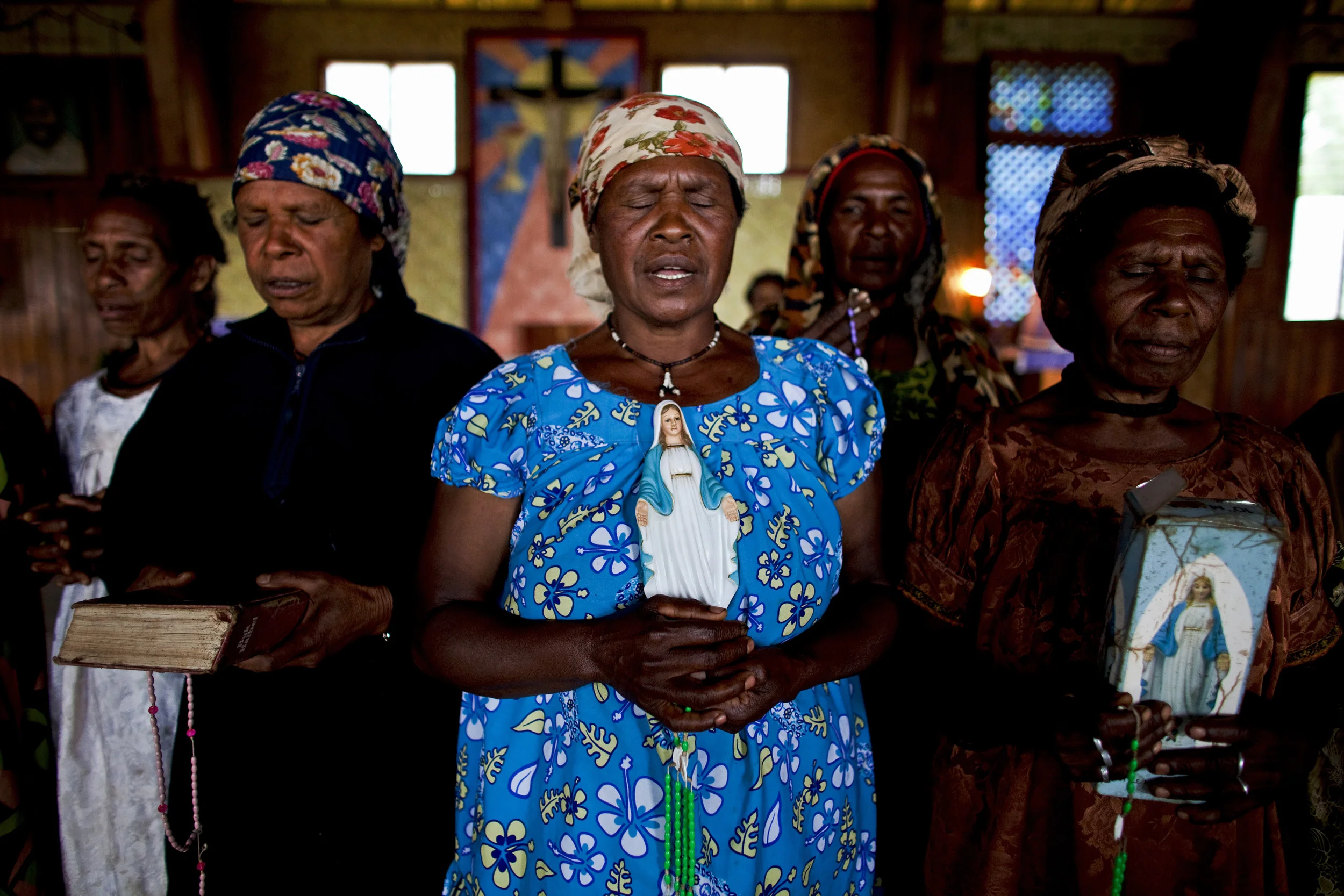 TARI GAP, SOUTHERN HIGHLANDS, PAPUA NEW GUINEA-DECEMBER 2008: Hela Huli Christian women photographed at a Catholic Church, Tari Gap, Papua New Guinea, 17 December 2008. These women are supporters of the Catholic Church which they say is encouraging