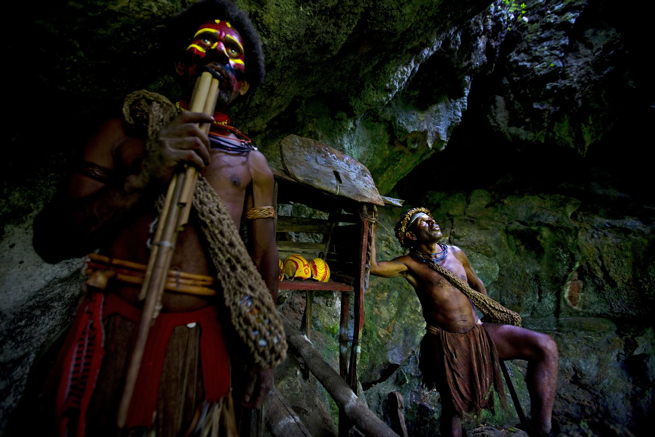 TARI GAP, SOUTHERN HIGHLANDS, PAPUA NEW GUINEA-DECEMBER 2008: Huli Wigmen "Magic-Men" photographed at an ancestor skull cave, Tari Gap, Papua New Guinea, 17 December 2008. These "Magic-Men" keep the old tradition of ancestor protection alive, they m