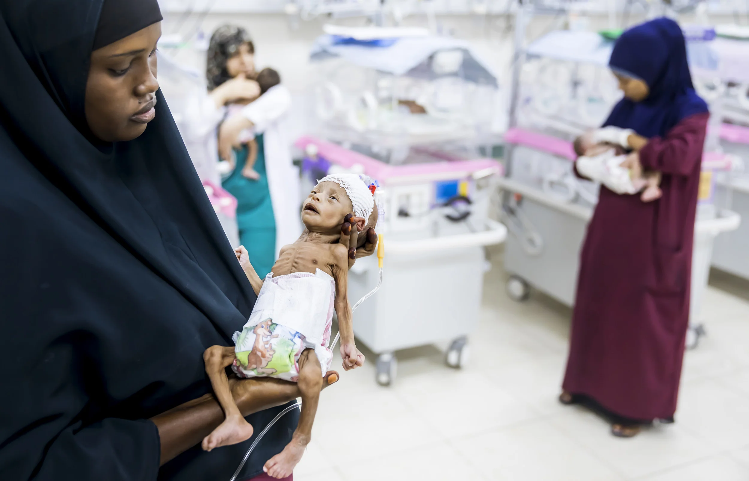 MOGADISHU, SOMALIA, 3 AUGUST 2017: Nurses attend premature babies inside the new neo-natal unit at the Turkish built and run hospital in Mogadishu. The child in this image weighed only 600 grams at birth and would surely have died without this speci