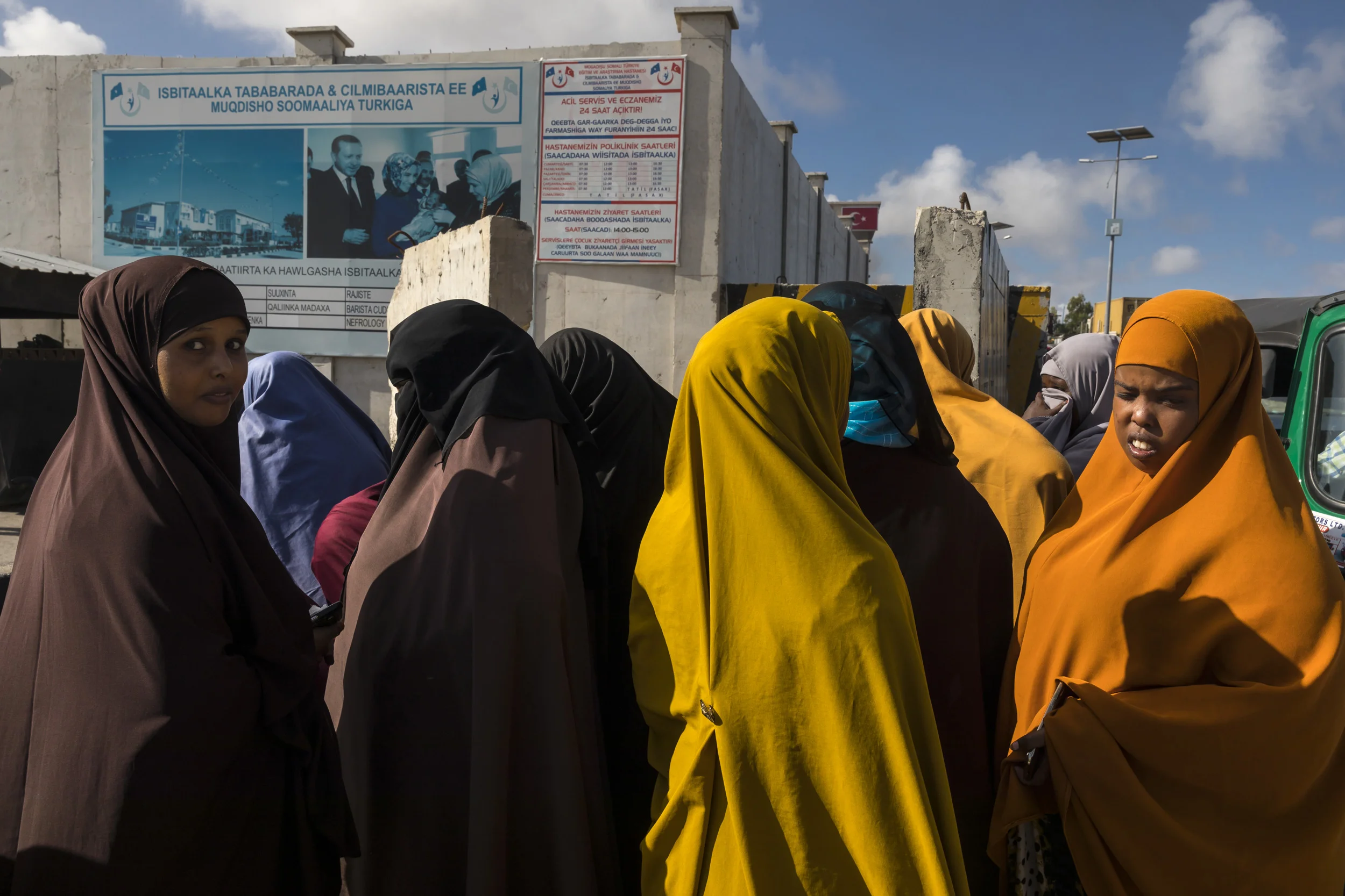 MOGADISHU, SOMALIA, 1 AUGUST 2017: Somali woman queue to pass through security at a new Turkish built hospital in Mogadishu. This new facility is one of many initiatives the Turks have undertaken in the city, the new airport is another example of in