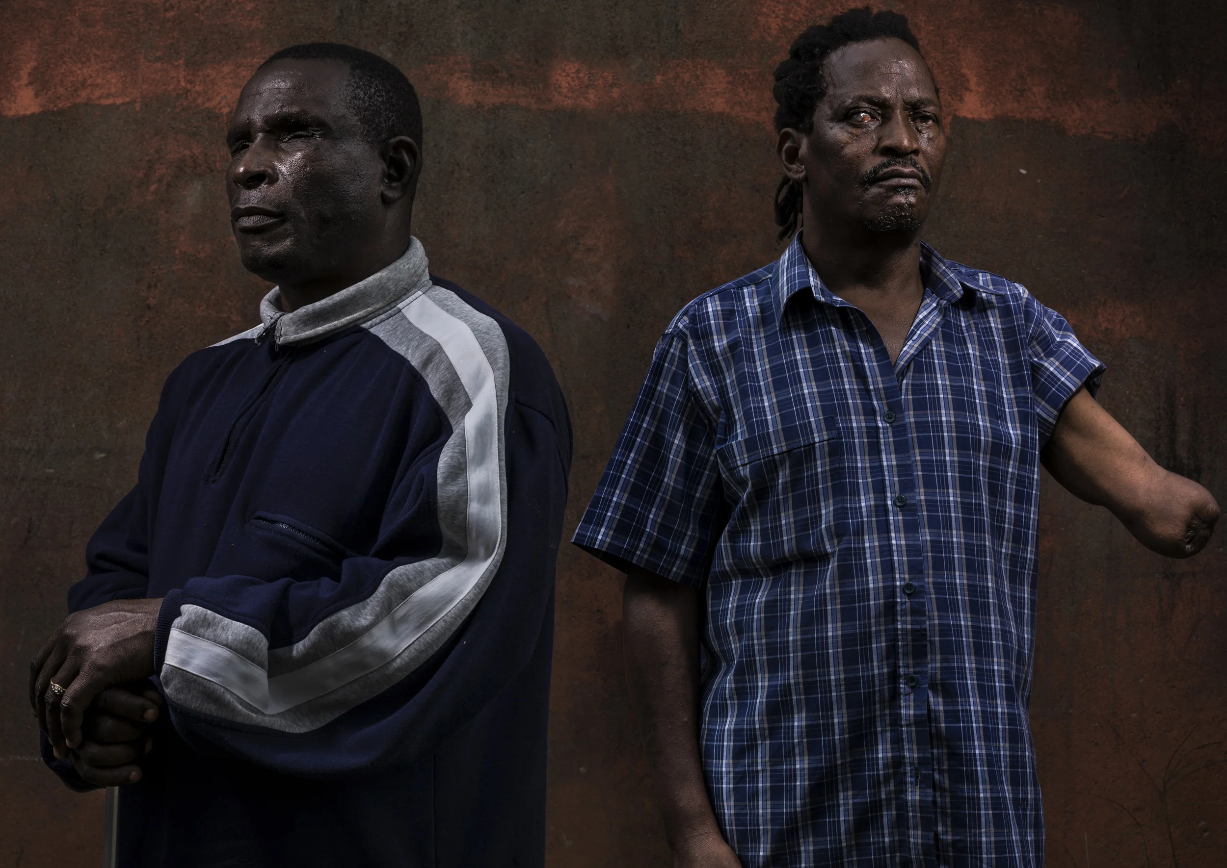 MOTOLLA CITY, MAPUTO, MOZAMBIQUE, 24 NOVEMBER 2013: Jose Magleso Nalabo, 48, was blinded while soldiering for FRELIMO during Mozambique's brutal civile war, he is seen outside his squatter housing in abandoned accomodation in Motolla City, Maputo, M