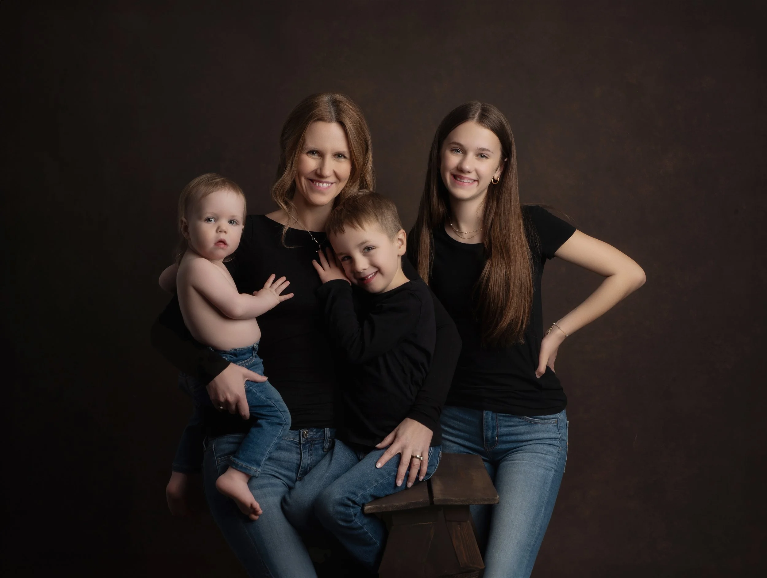 A family portrait of four people. 