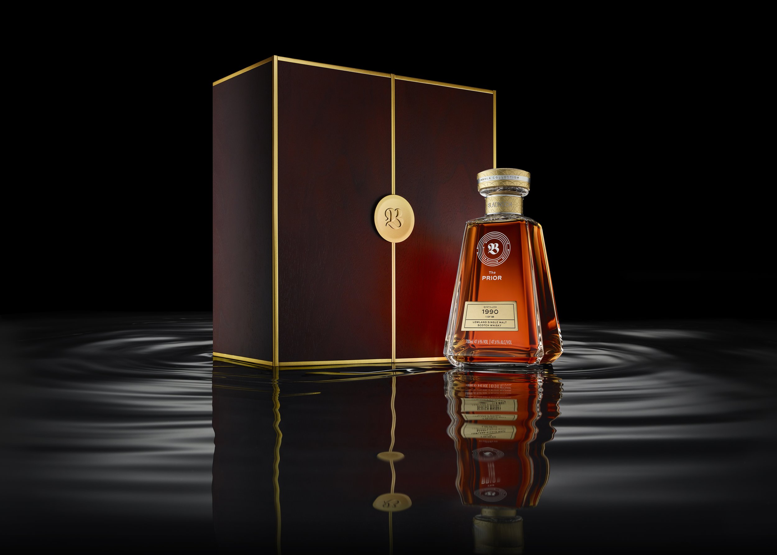 Bladnoch Prestige Whisky bottle and case on rippled water. Samhla Collection.