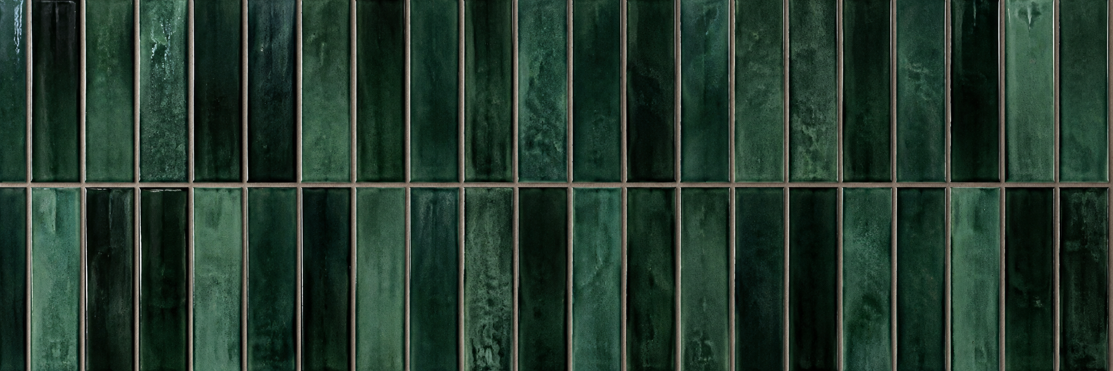 Emerald green vertical mosaic tiles with precision joint alignment