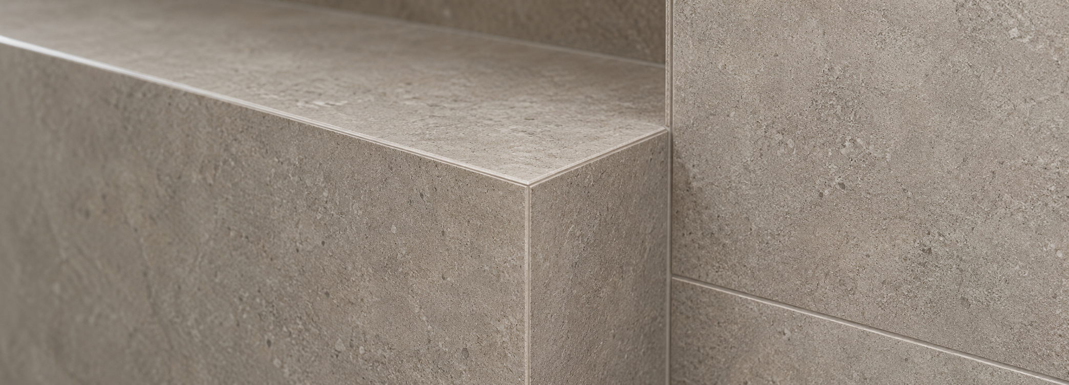 Precision mitred porcelain tile corner with seamless edge detailing