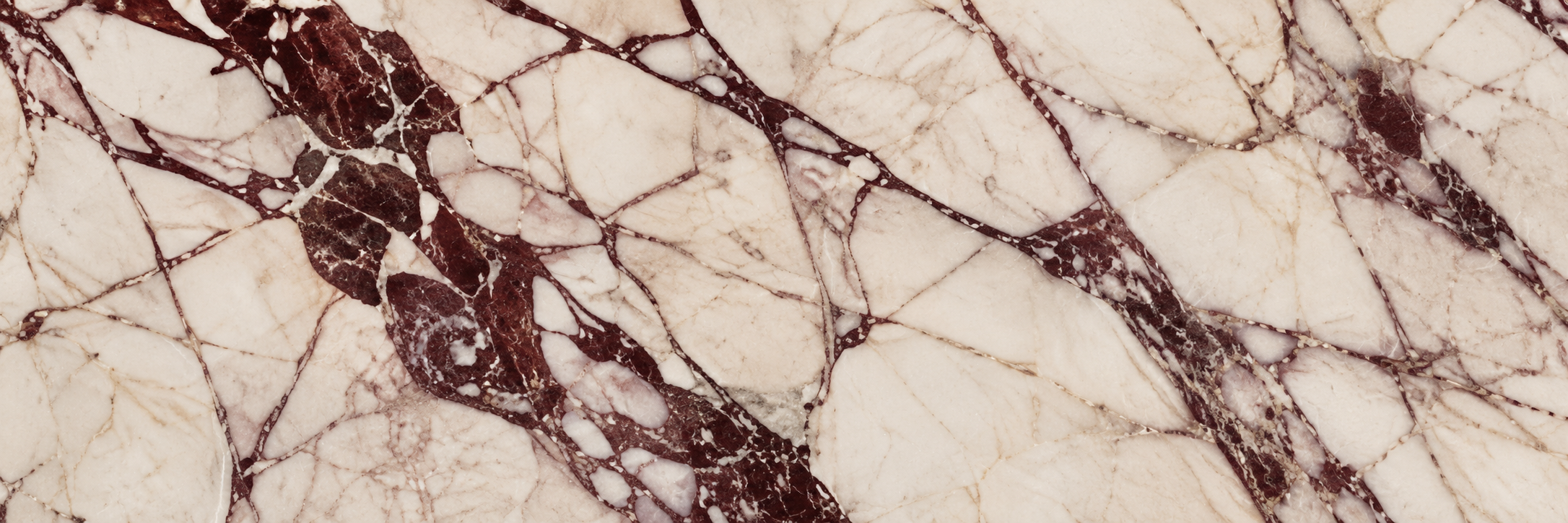 Ivory natural stone with distinctive burgundy veining