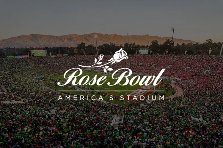 Aerial view of a packed football stadium with a large crowd, with the Rose Bowl logo overlayed in the center.