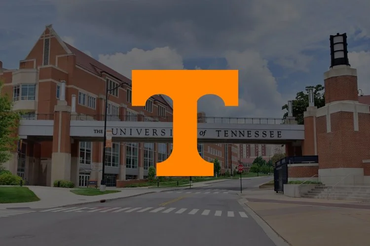 Entrance of the University of Tennessee with a large orange T logo overlayed.