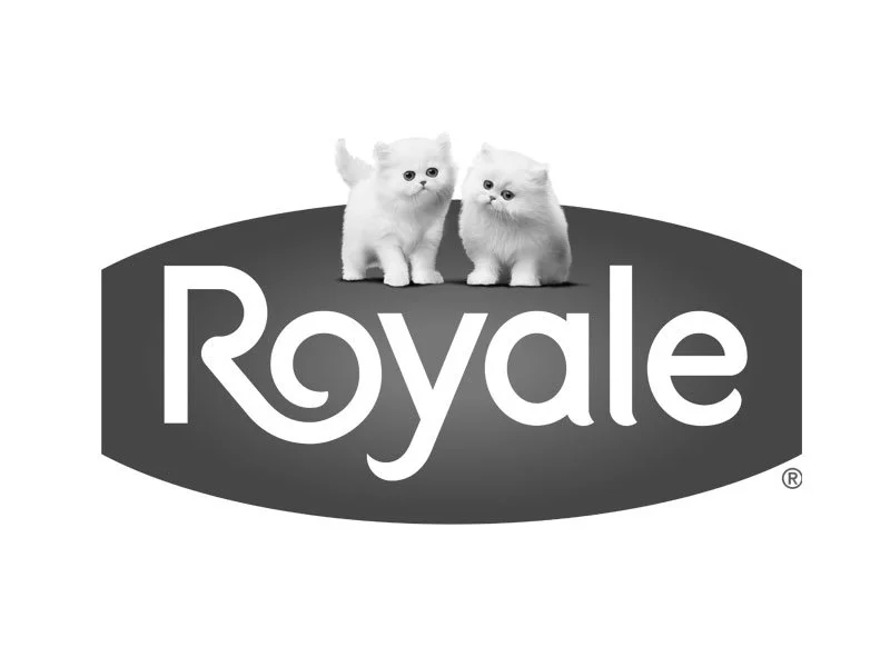 Black and white logo with the word 'Royale' and two small white kittens on top of the logo.