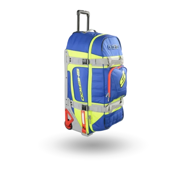 Blue and yellow Sherco sports roller equipment bag with a gray extendable handle and red wheels from Ogio