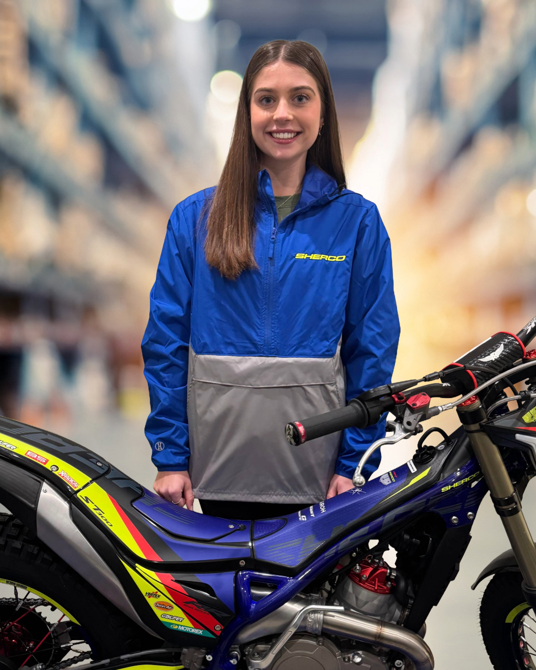Hailey Glueck stands with a Sherco Adam Raga edition