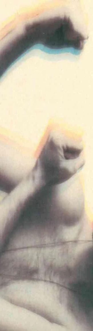 Close-up of a person's face with eyes closed and hand resting near their mouth, showing lips and part of the chin.