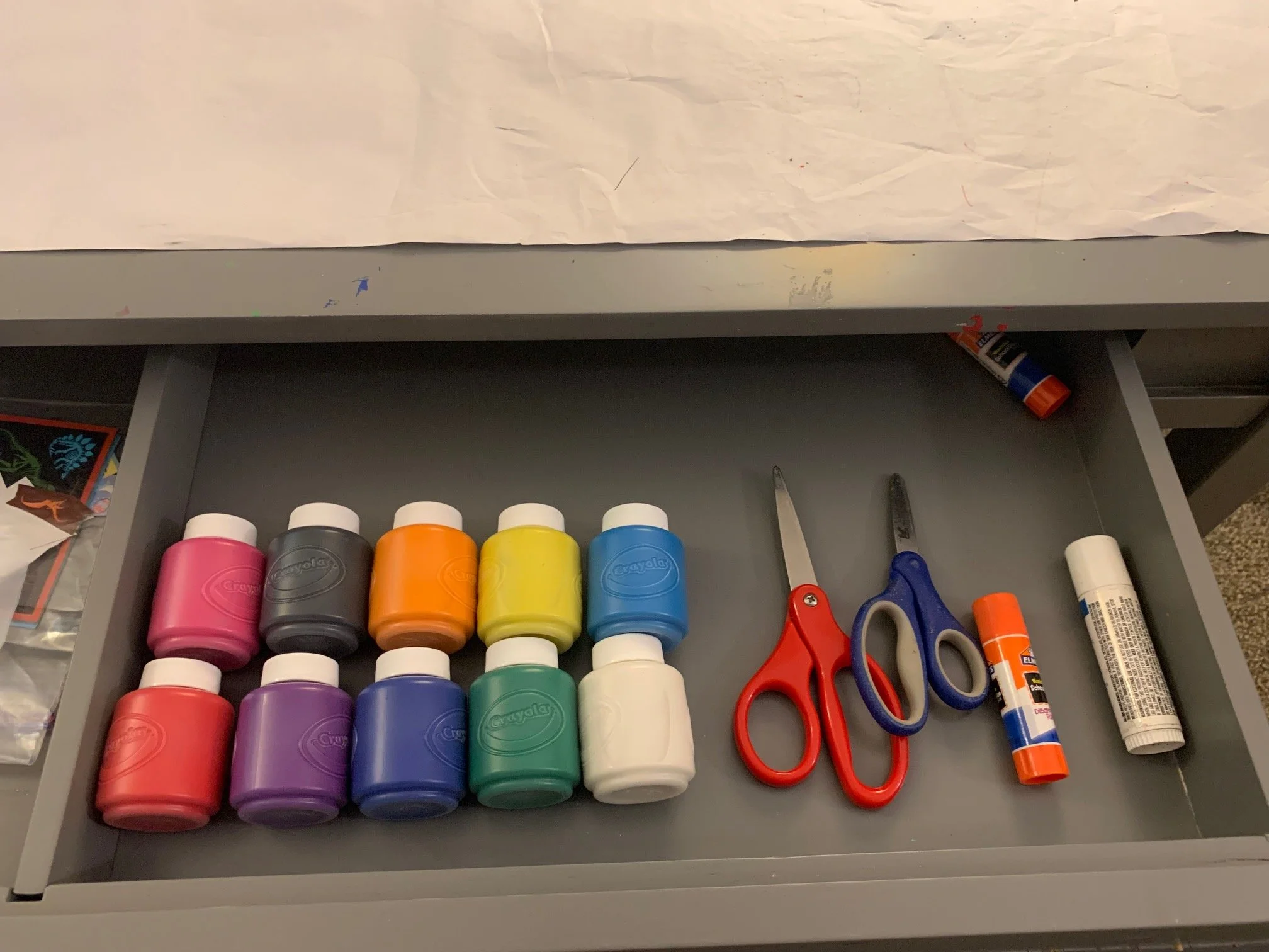 Washable paint and scissors safely stored away until we're ready to use them.