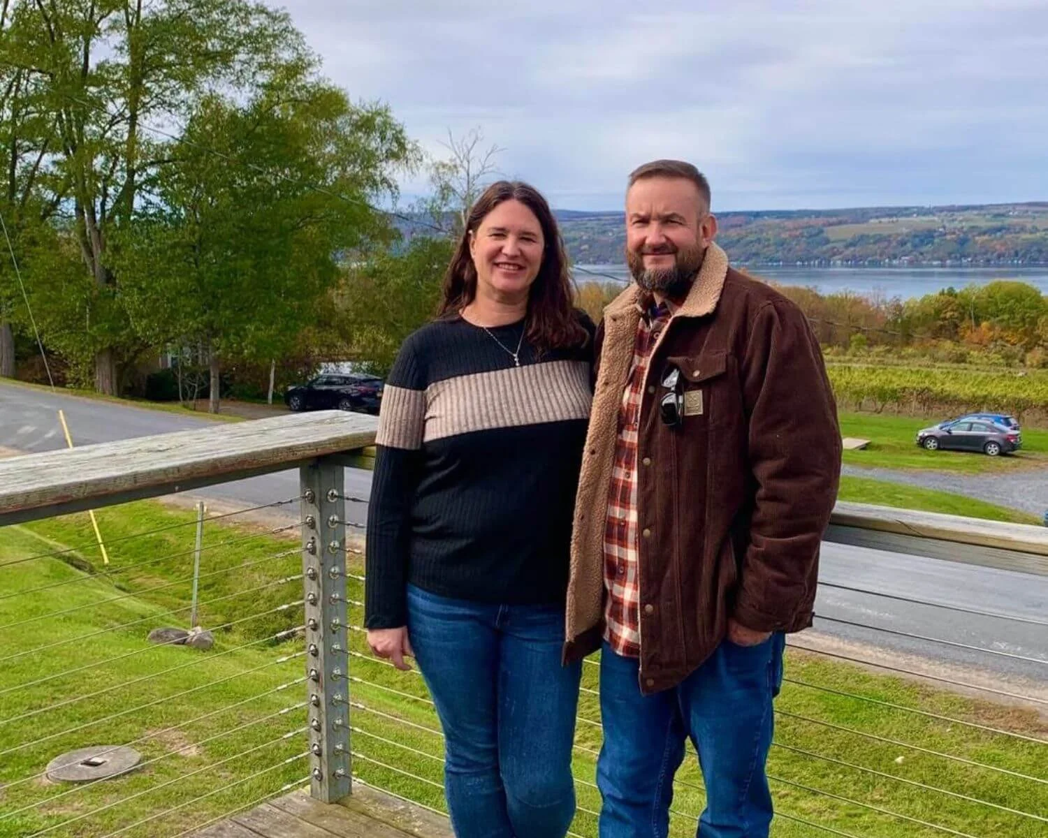 Couple enjoying a scenic overlook during a private Finger Lakes wine tour with FLX Chauffeur service