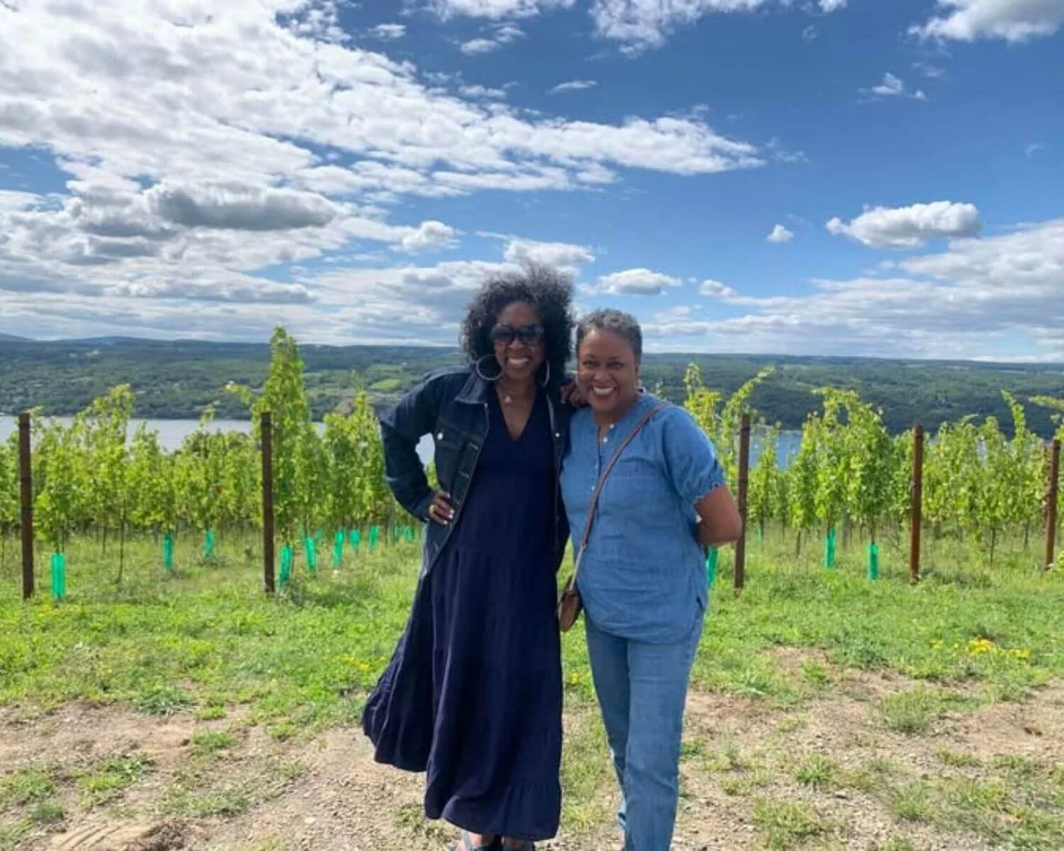 Guests enjoying a Seneca Lake vineyard visit during a private wine tour with FLX Chauffeur