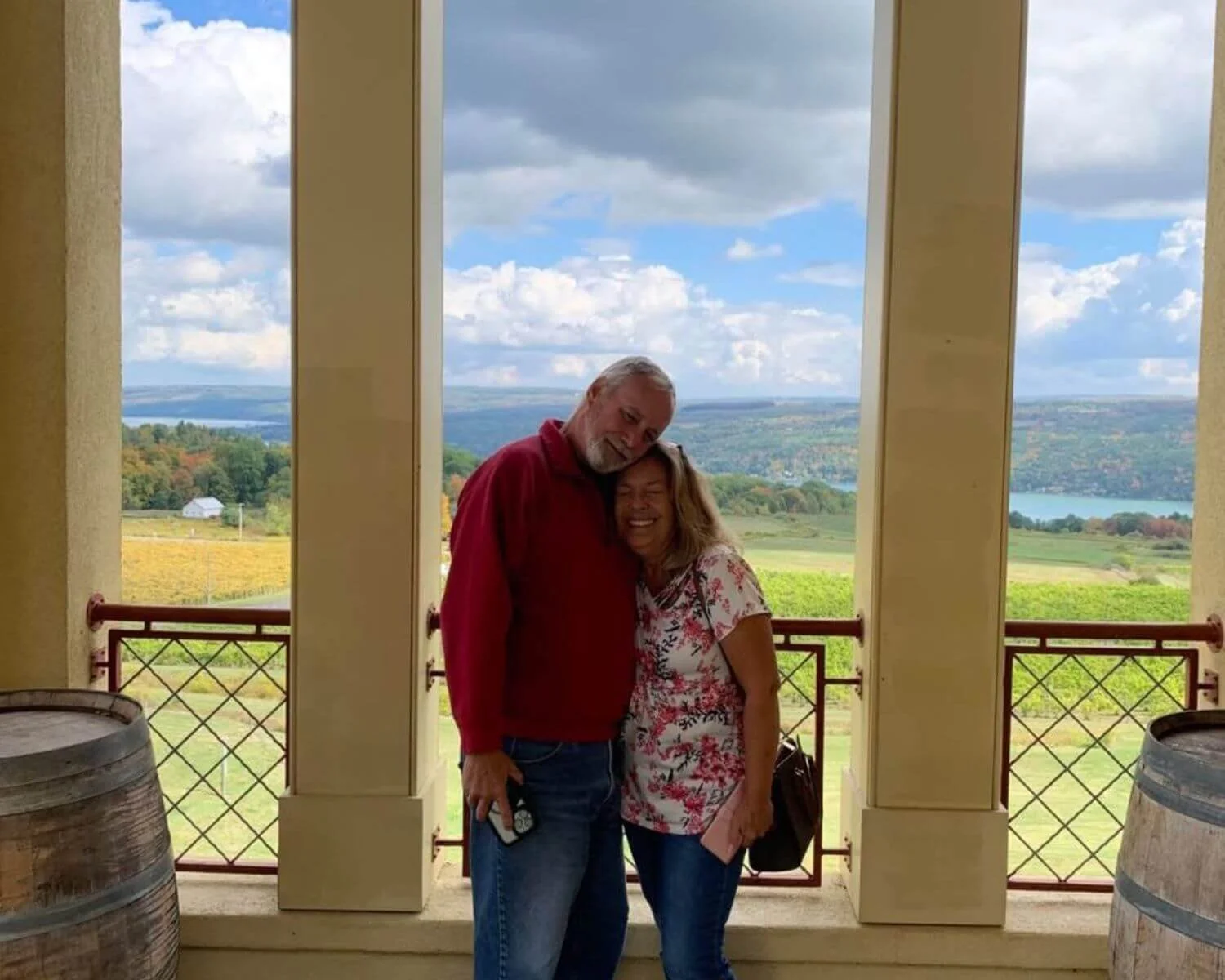 Couple enjoying scenic Finger Lakes lake views during a private wine tour with FLX Chauffeur