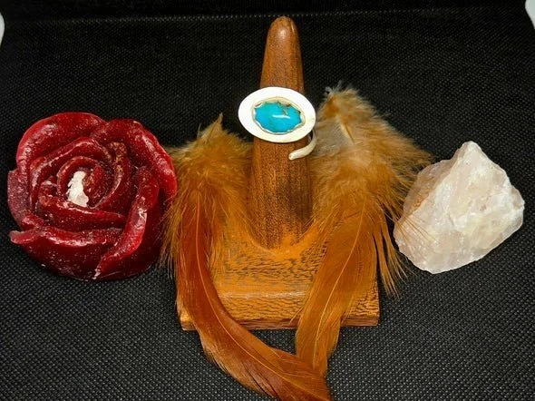 Front view of Adjustable handcrafted sterling silver ring with turquoise stone