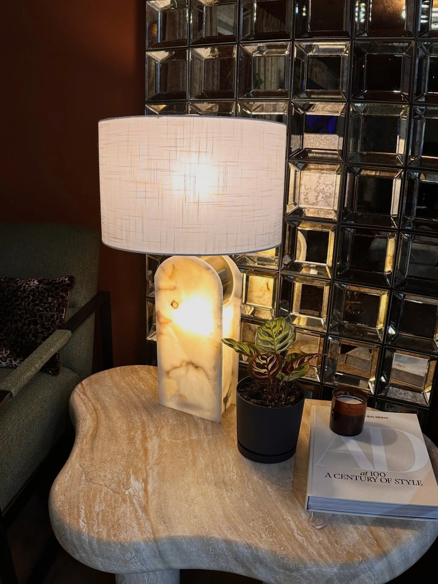 This corner holds so much of what I believe about home.

Stone with movement. Light that feels warm, not harsh. A living element grounding the space. Objects chosen not to impress&mdash;but to settle you.

Design isn&rsquo;t about filling a room. It&