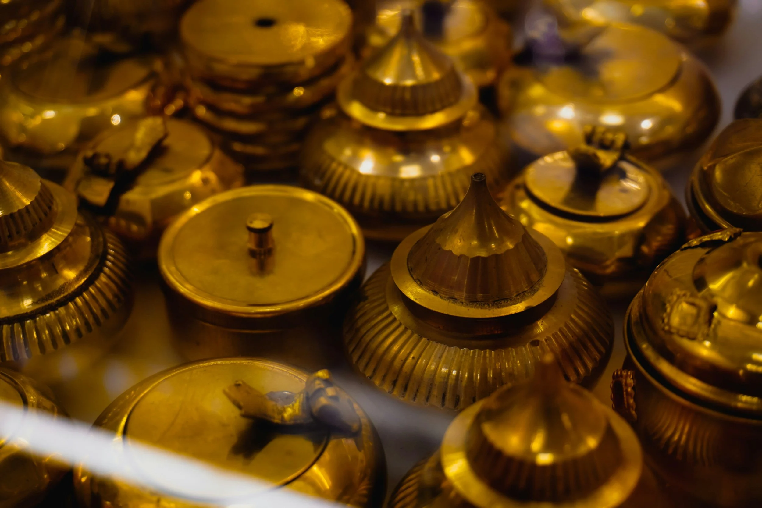Close-up photo of brass urns