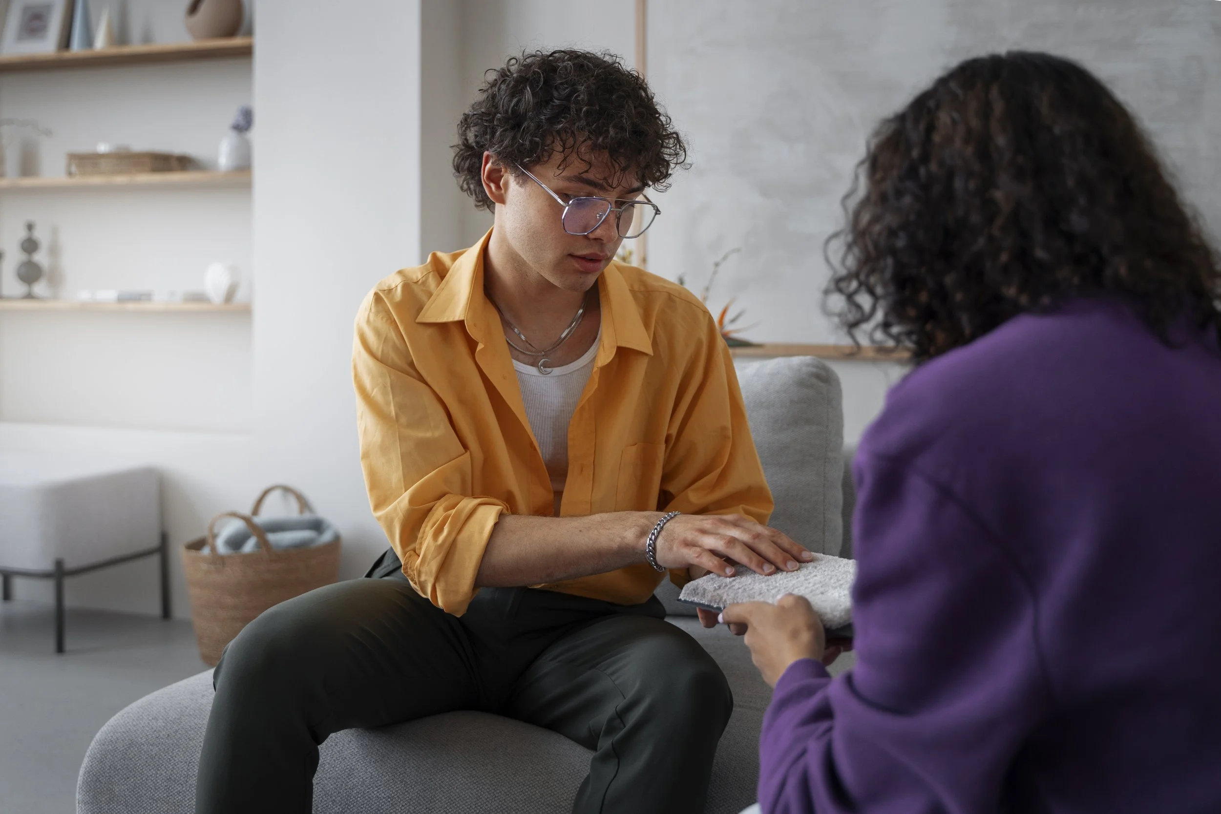 A young man talking to his therapist about In-Person therapy - Calm Harbor Counseling