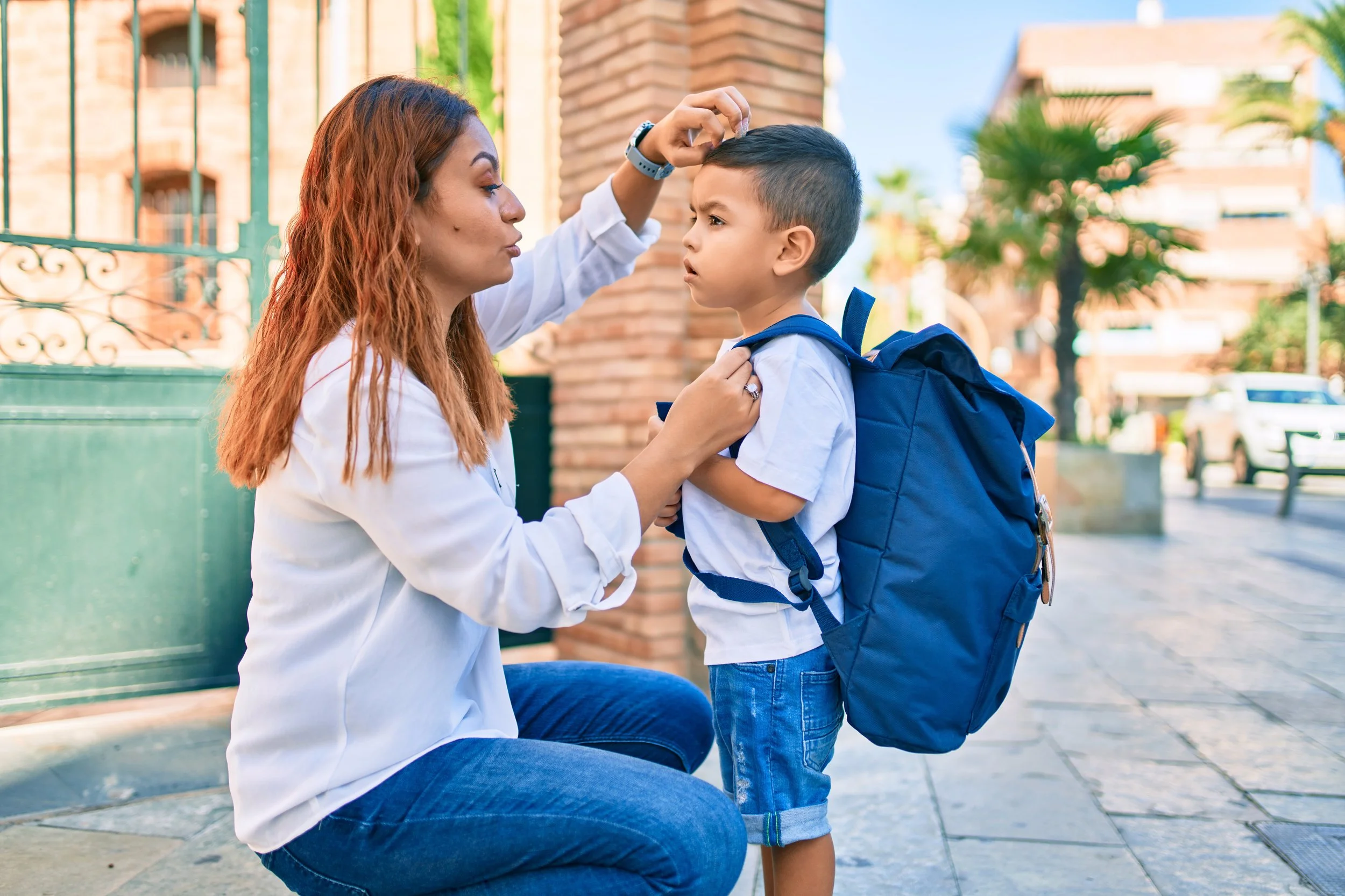 A mother talking to her child before taking him to school - Calm Harbor Counseling