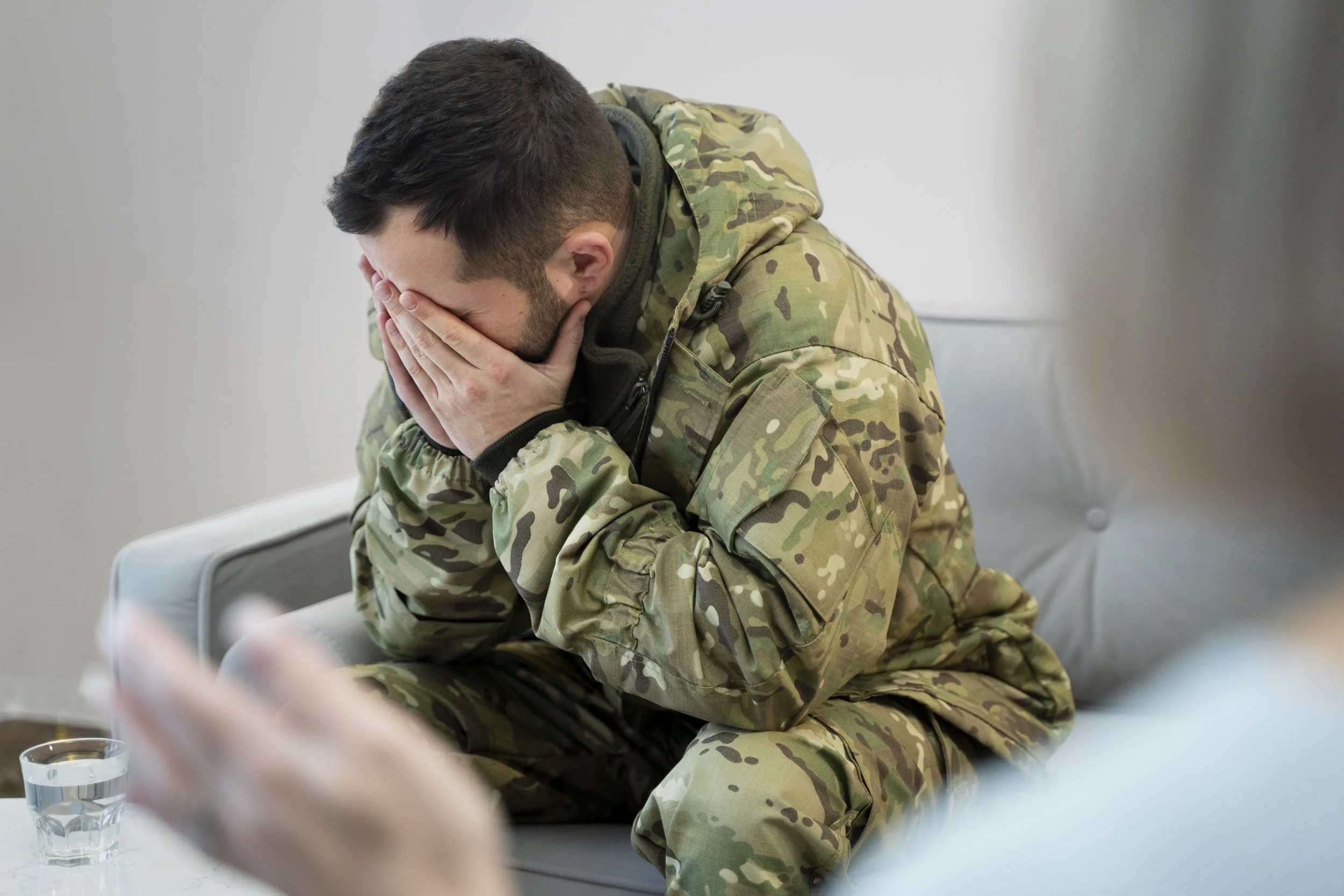 A veteran who has PTSD is consulting a therapist - Calm Harbor Counseling