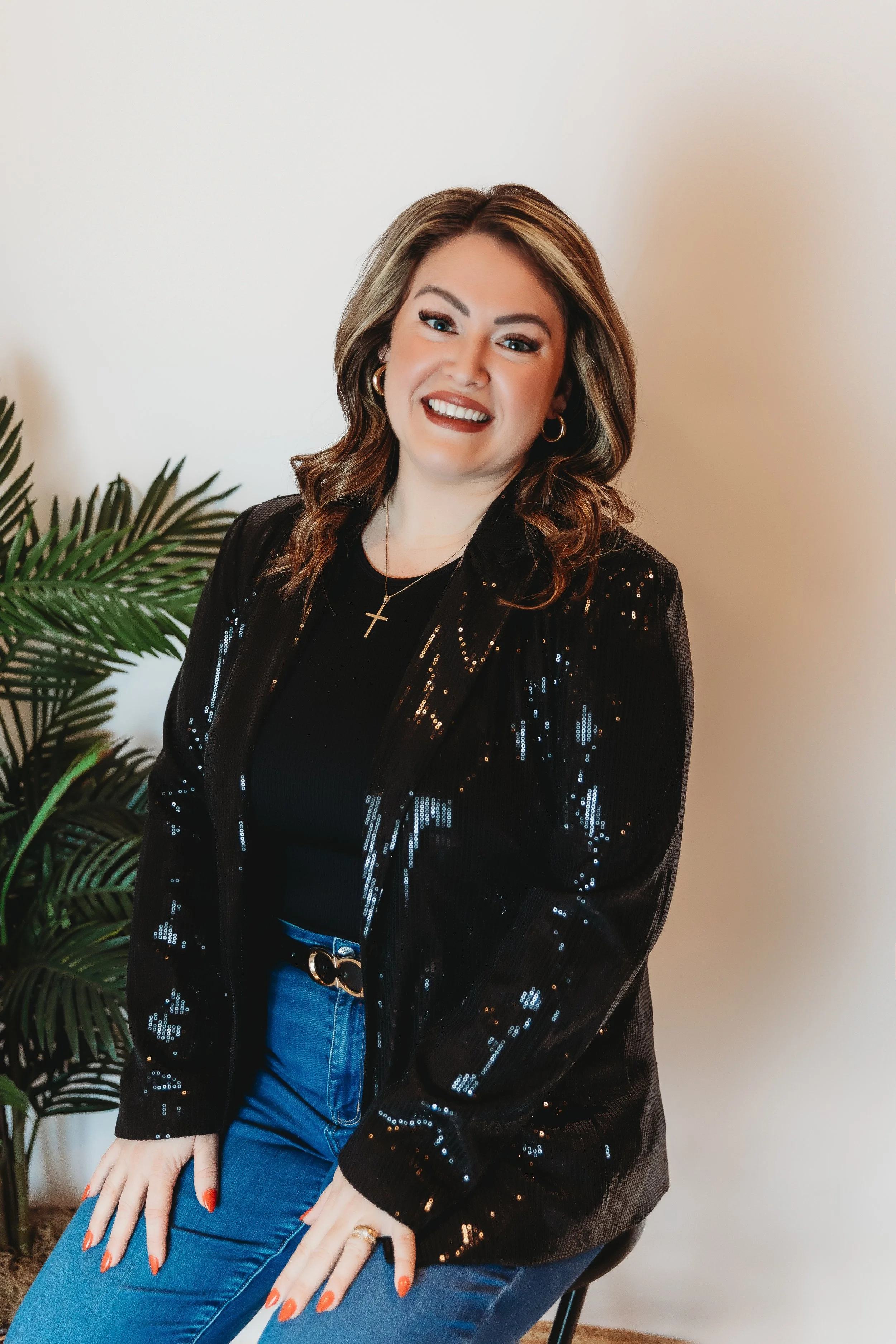 Cassandra Lambert, Founder of Off The App Dating smiling while seated in a studio portrait