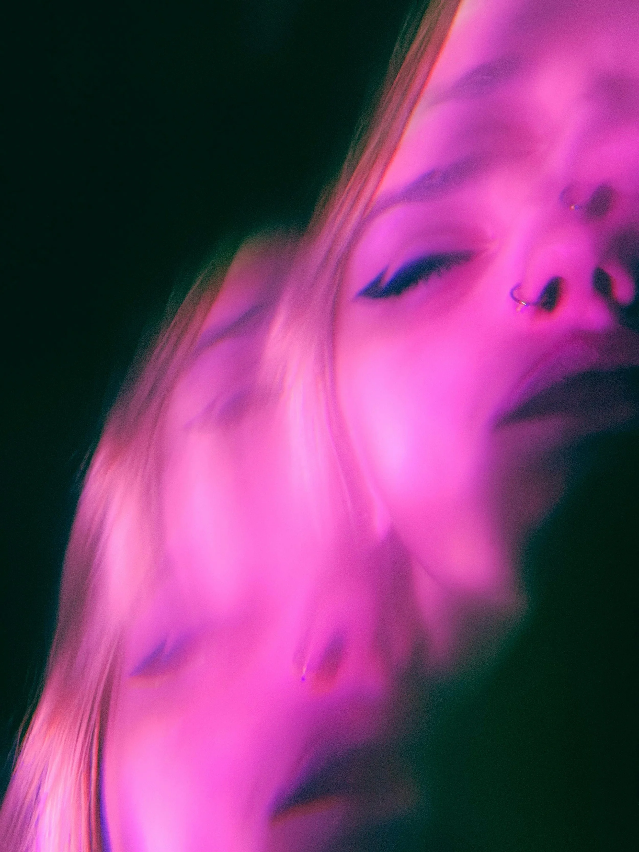 Black and pink image of a woman's face distorted. ADHD in woman can present as heightened emotional dysregulation and she could benefit from virtual therapy for women with ADHD in AZ and SC to help her cope better