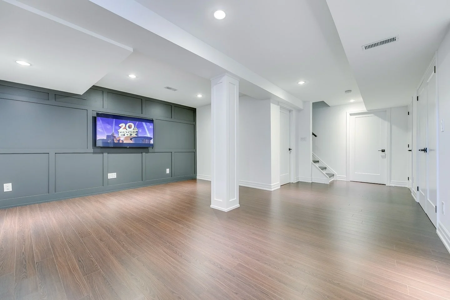 Even smaller basements deserve a high-quality finish &mdash; and this one proves it.

✔️ Oak stairs
✔️ Built-in wine fridge with quartz top
✔️ Custom accent wall with TV mount
✔️ Hidden sump pump enclosure
✔️ Solid wood post with modern trim

We pack