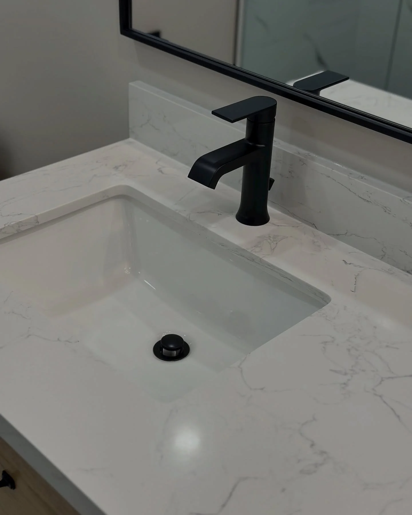✨ Sleek. Simple. Sophisticated.
This modern matte black faucet paired with a white under-mount sink and quartz countertop is the perfect touch of luxury for any bathroom upgrade.

📍 Designed &amp; Installed by Finished Basements TO
📩 DM us to start