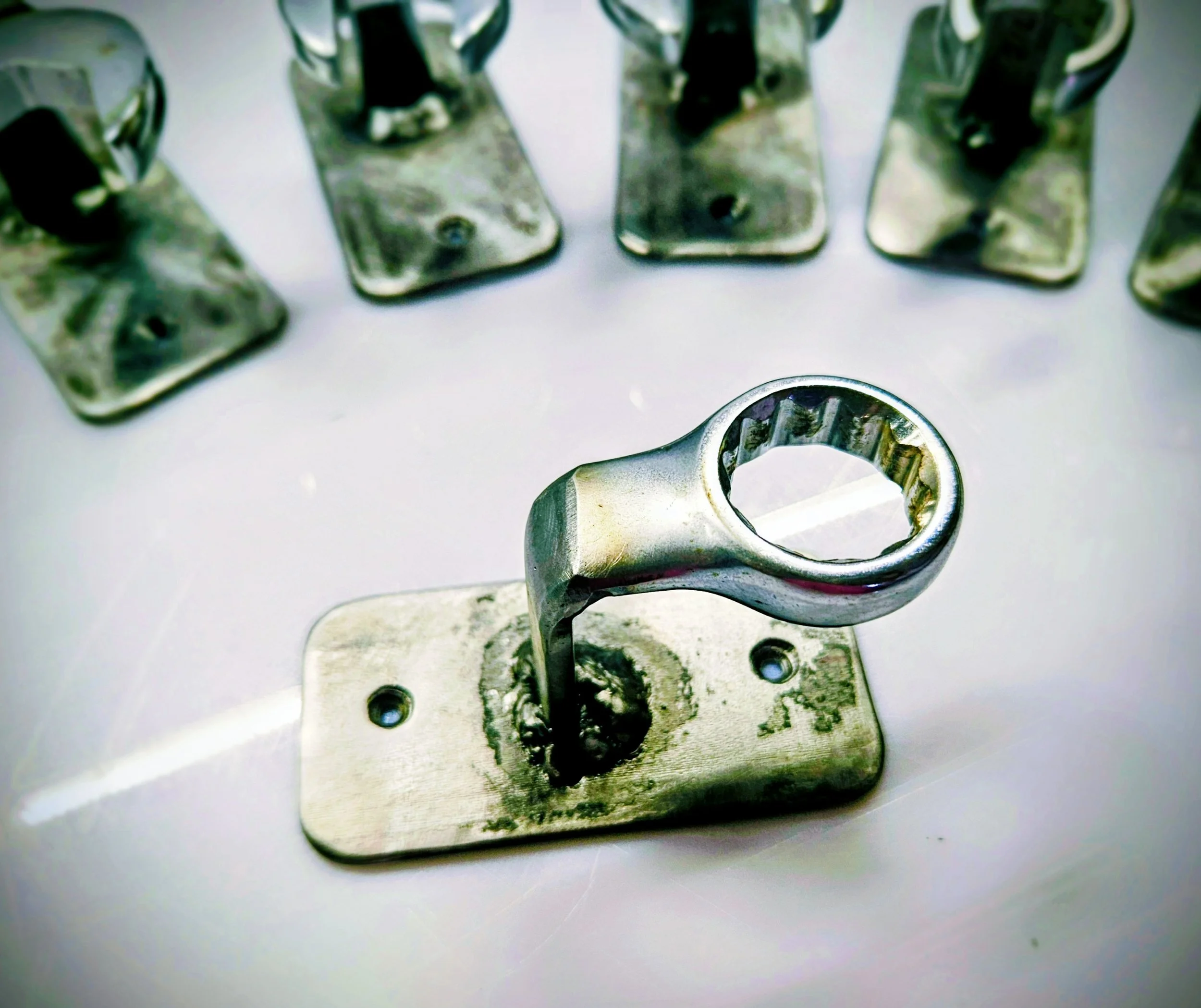 Welded, drilled, brushed and clear coated.