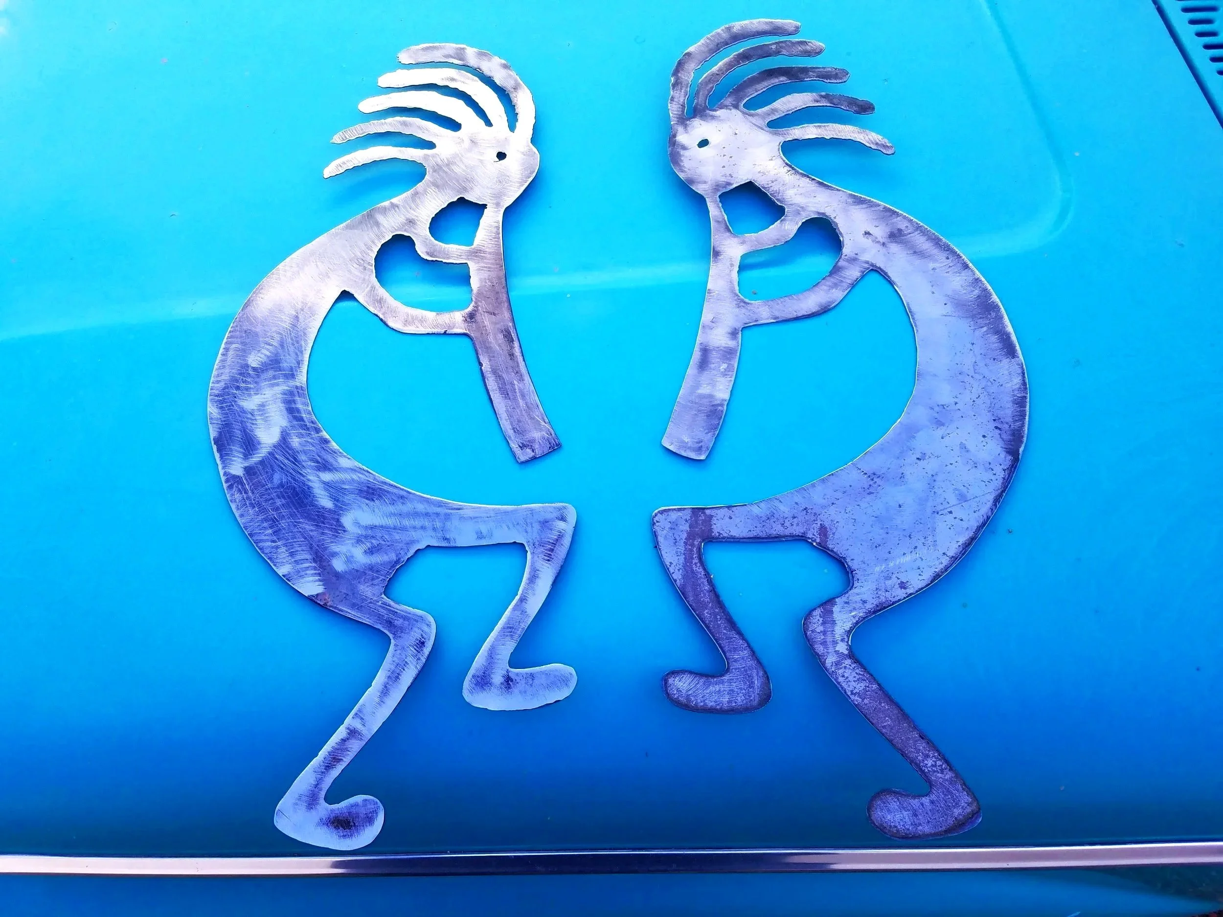Plasma cut by hand Kokopelli to be attached to a security screen door