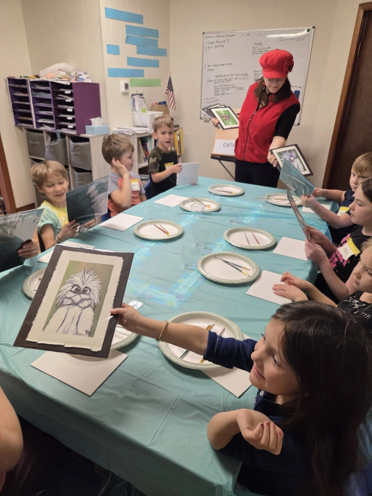 A local artist taught the children how to paint landscapes on canvas while sharing her latest work. 