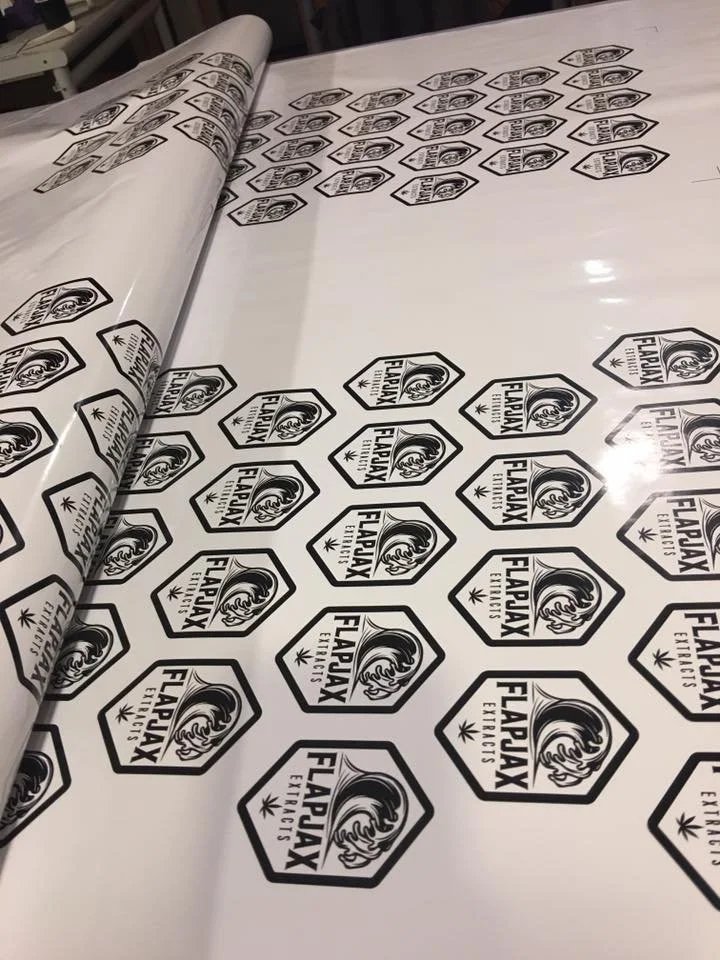 Sheet of stickers featuring a custom logo.