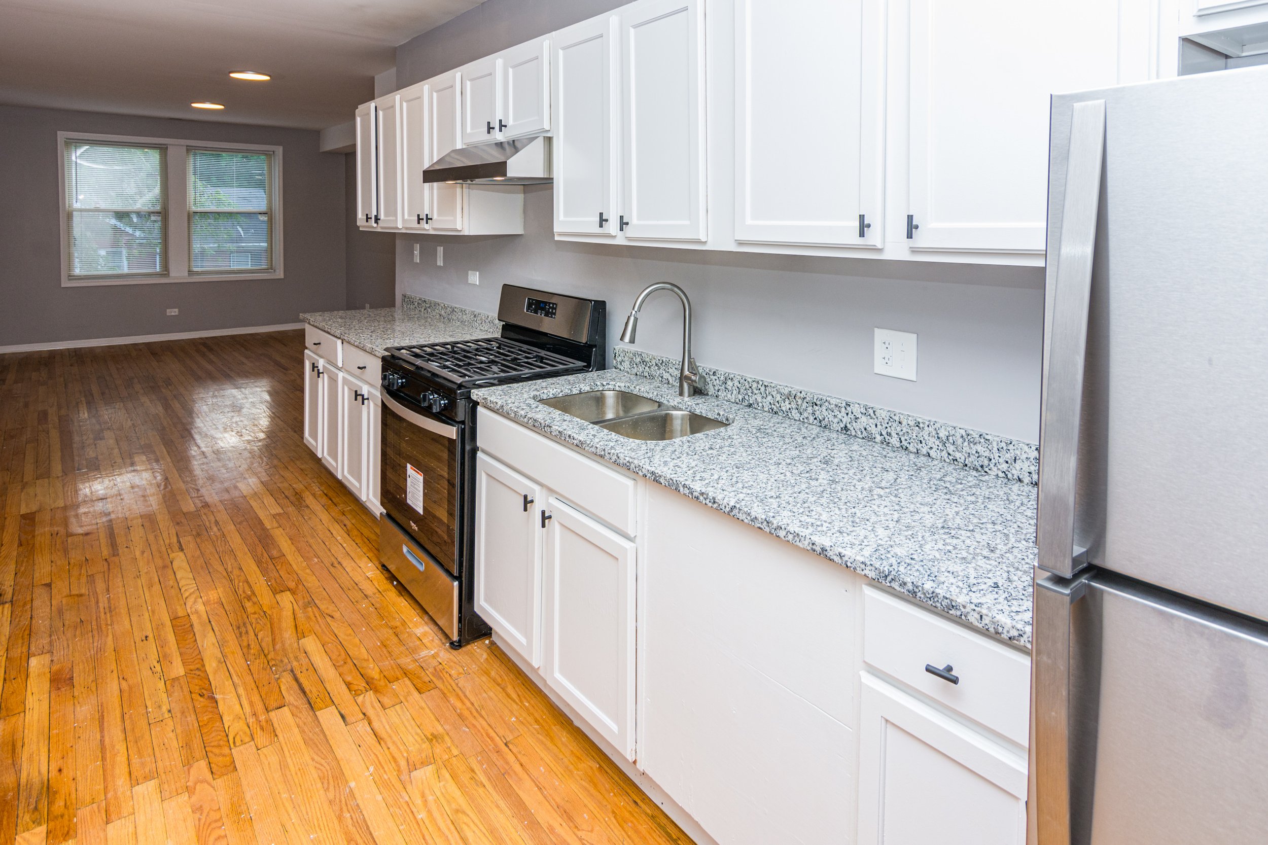 Renovated kitchen with stainless steel appliances at 7350 S Phillips Ave