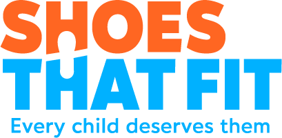 Logo of Shoes That Fit, a community partner of Vulcan Mission Gorge, highlighting the company's commitment to helping children thrive through community investment and support for local nonprofit organizations.