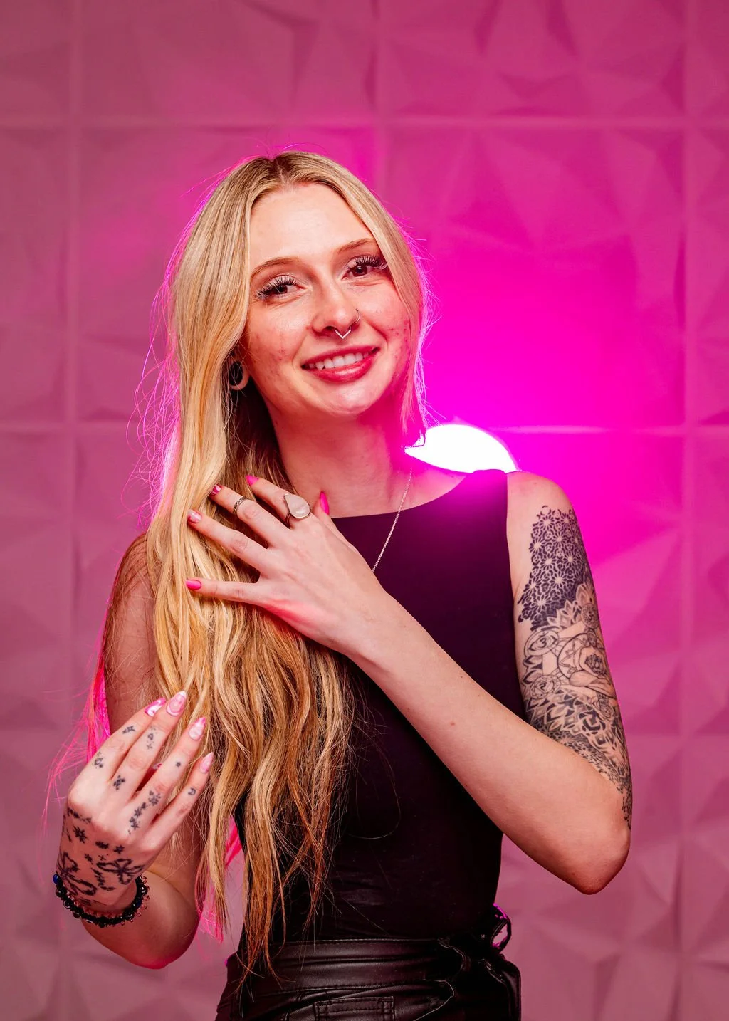 Headshot of Cree smiling at the camera